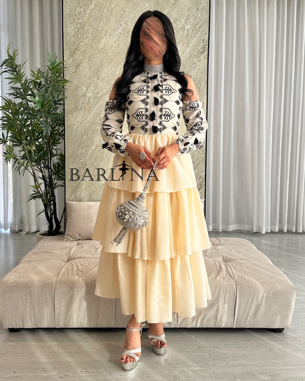 Beige layered dress with black embroidered details