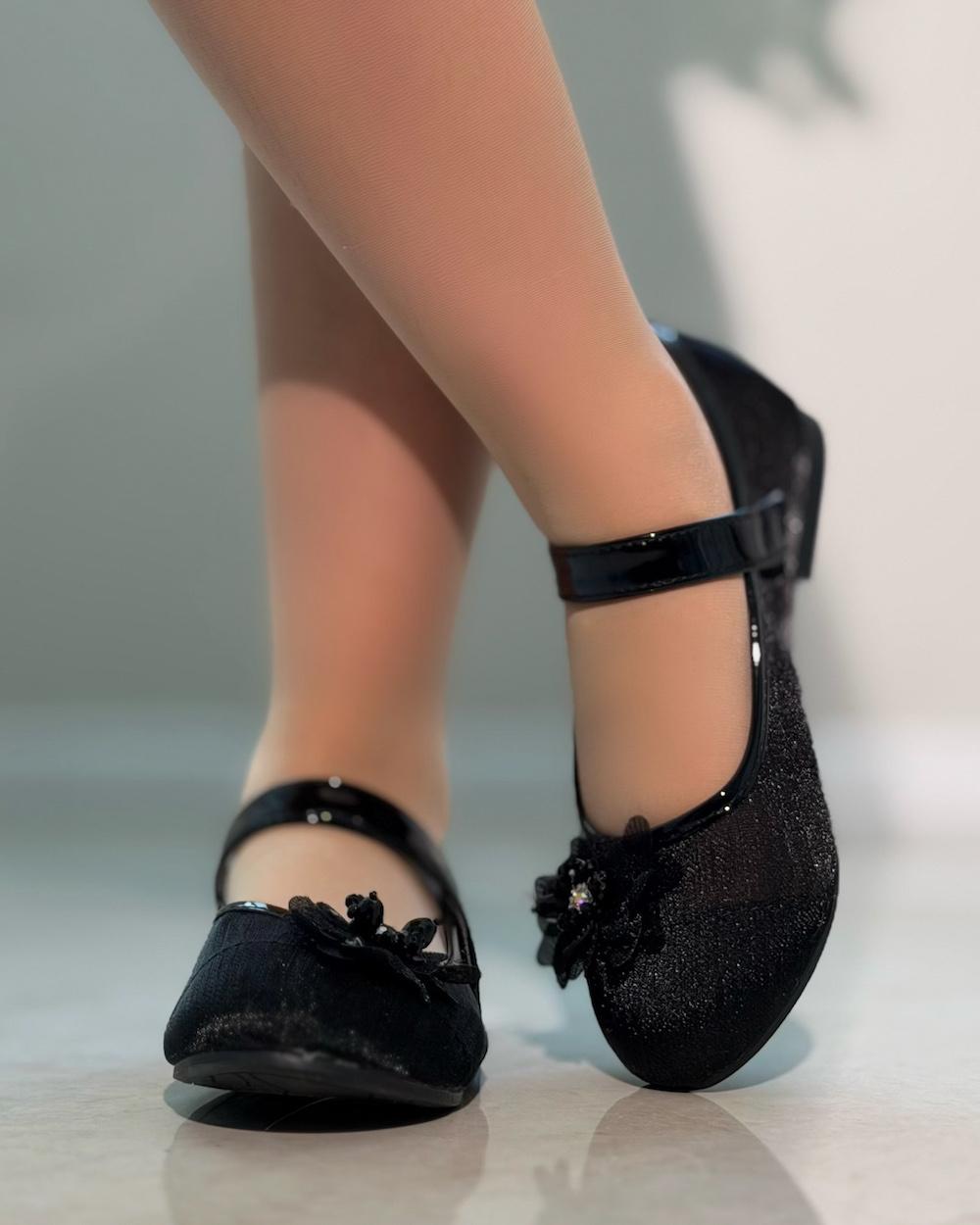Girls' shoes with delicate details and a subtle sheen