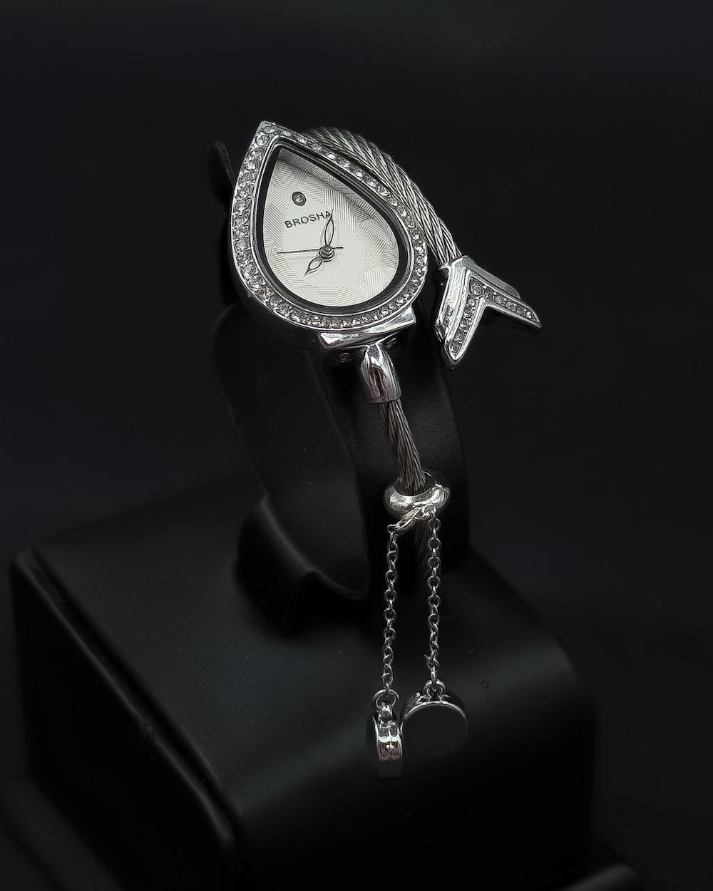 Teardrop-shaped wristwatch adorned with sparkling crystals