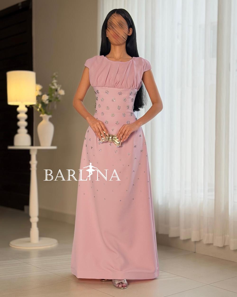 Occasion dress with a fitted waist and scattered crystals