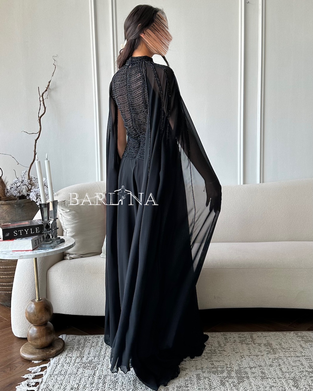 Royal black dress with lobes and cape sleeves