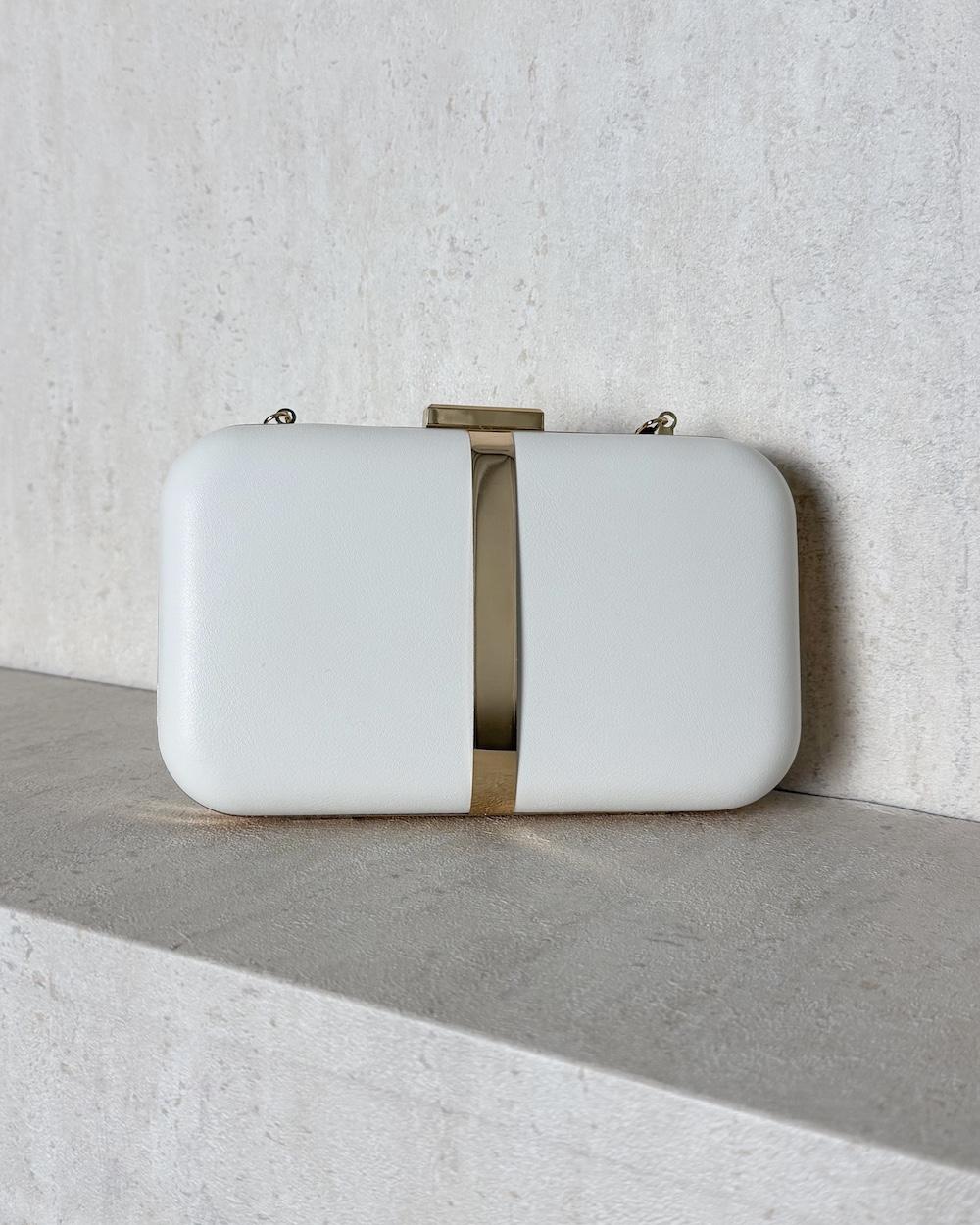Evening bag decorated with a gold metal ribbon