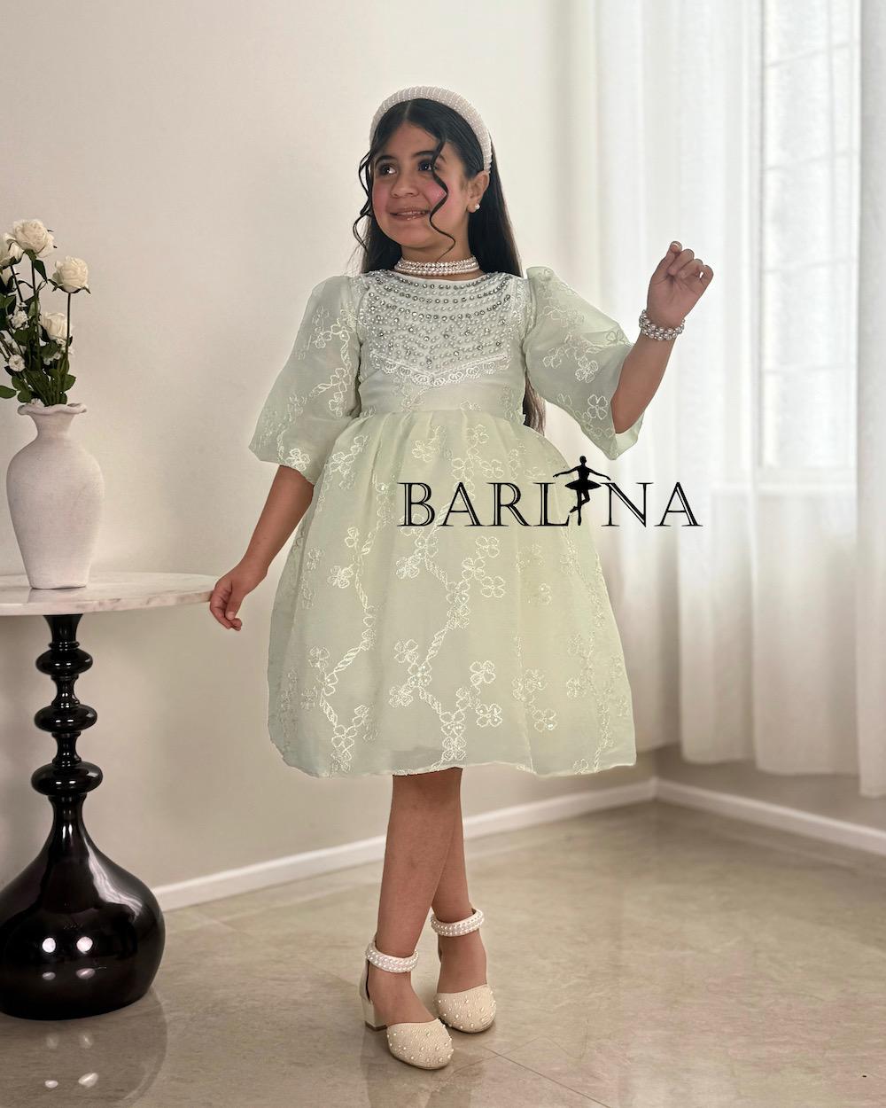 A soft, pearl-decorated girl's dress