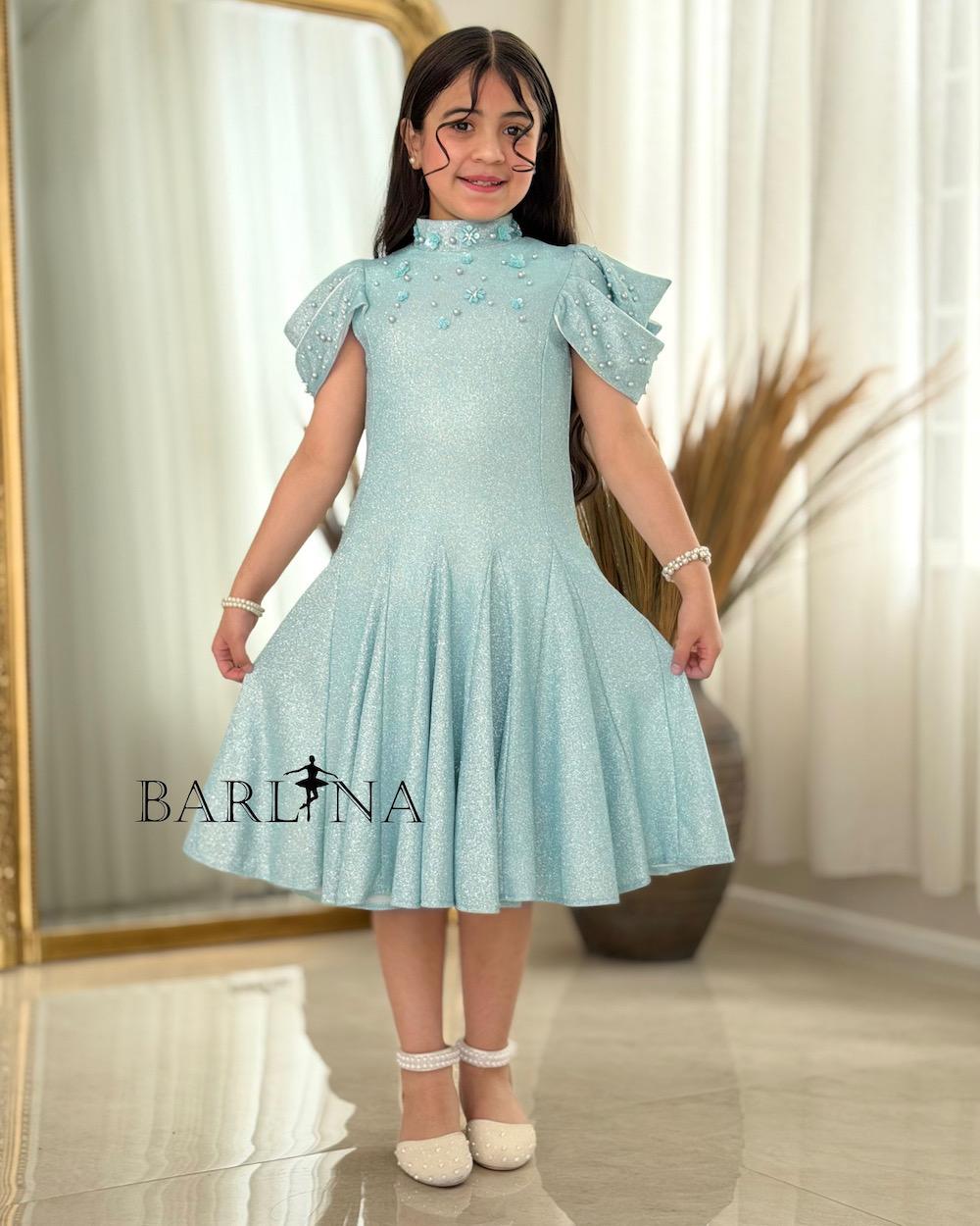 A sparkly girl's dress decorated with pearls
