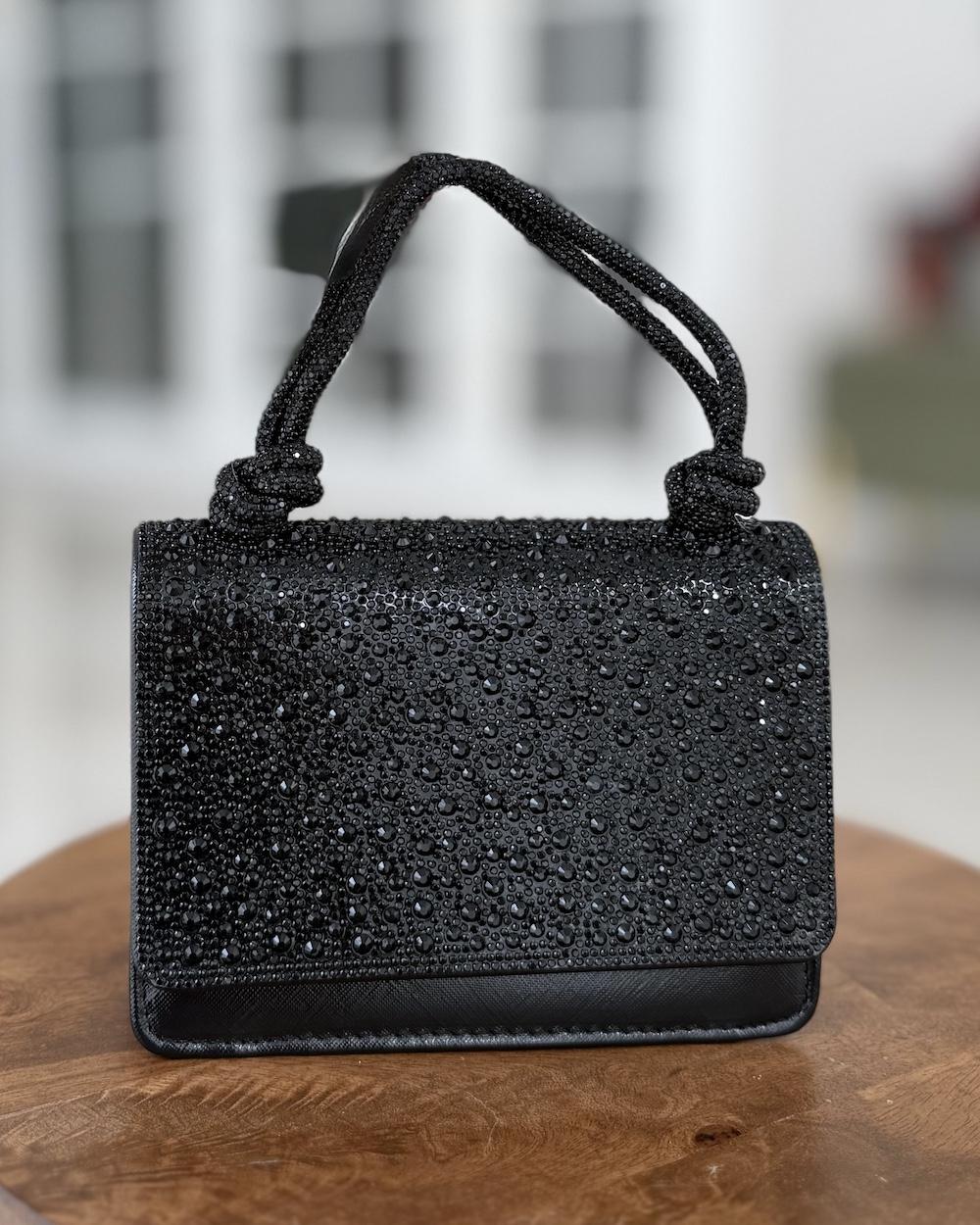 Evening handbag with a knotted top handle
