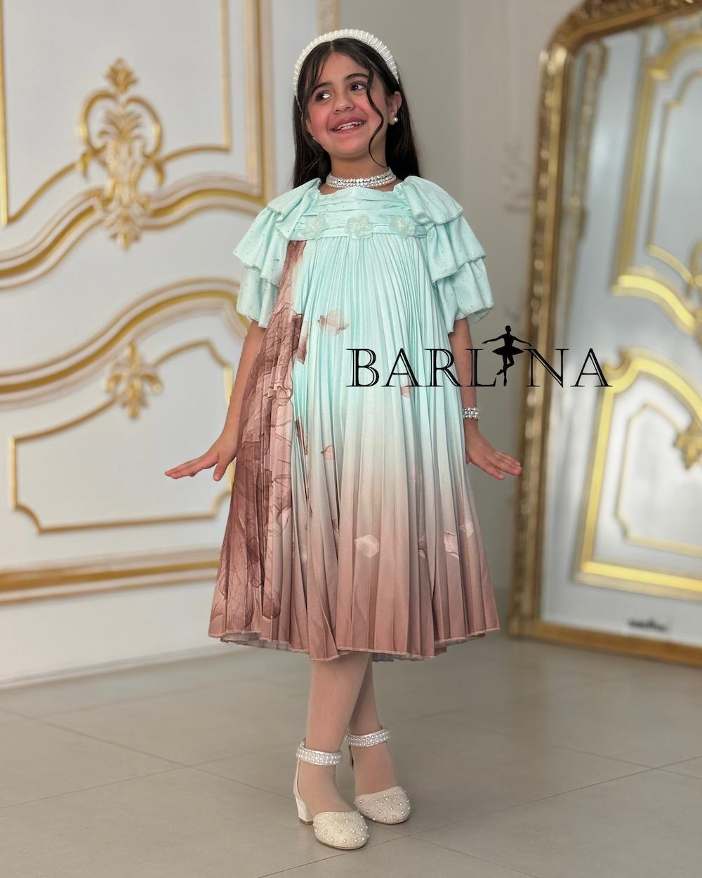 A soft girl's dress decorated with delicate prints