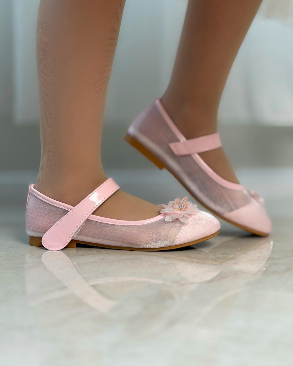 Girls' shoes with delicate details and a subtle sheen