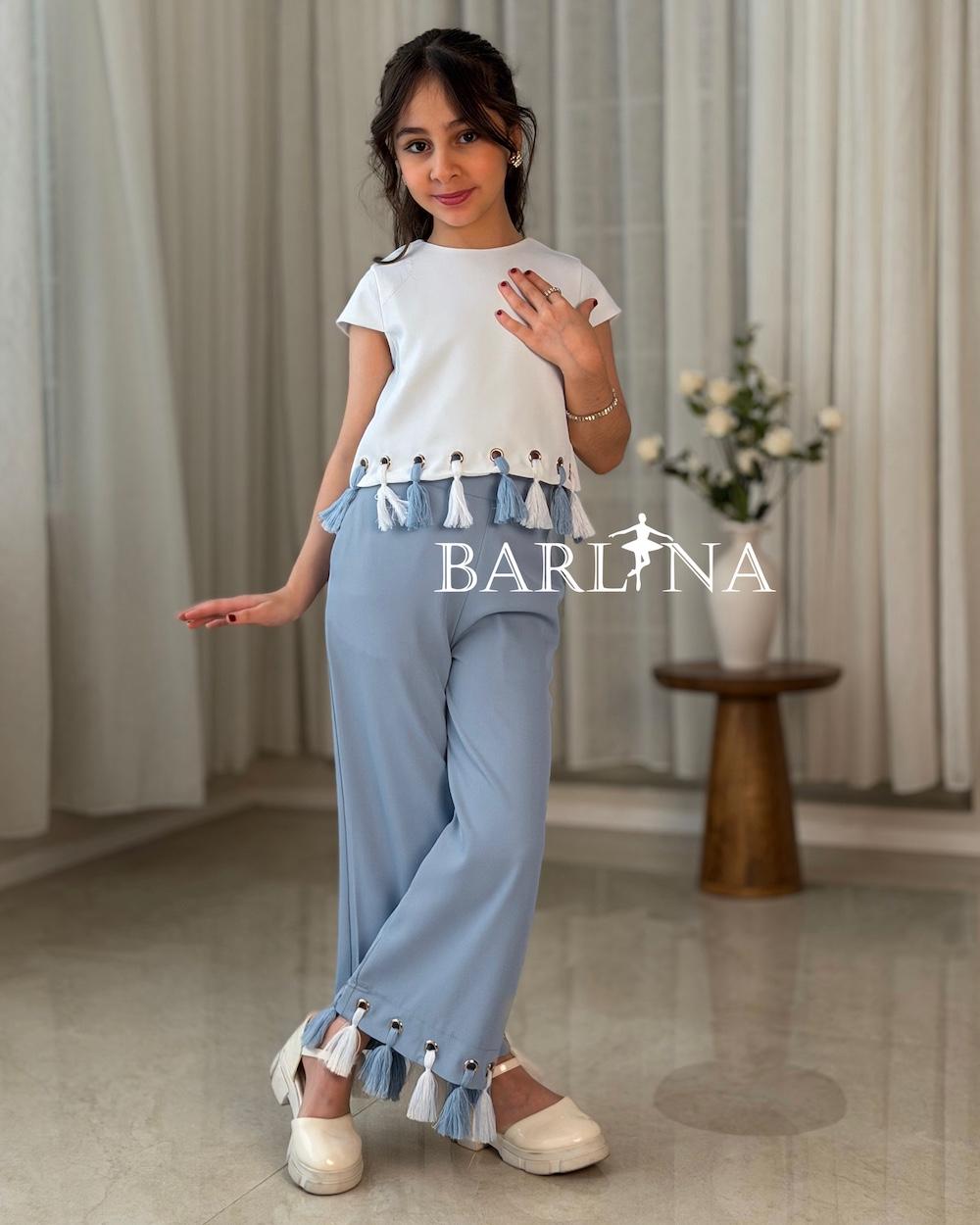 Girls’ set with a white blouse adorned with tassels