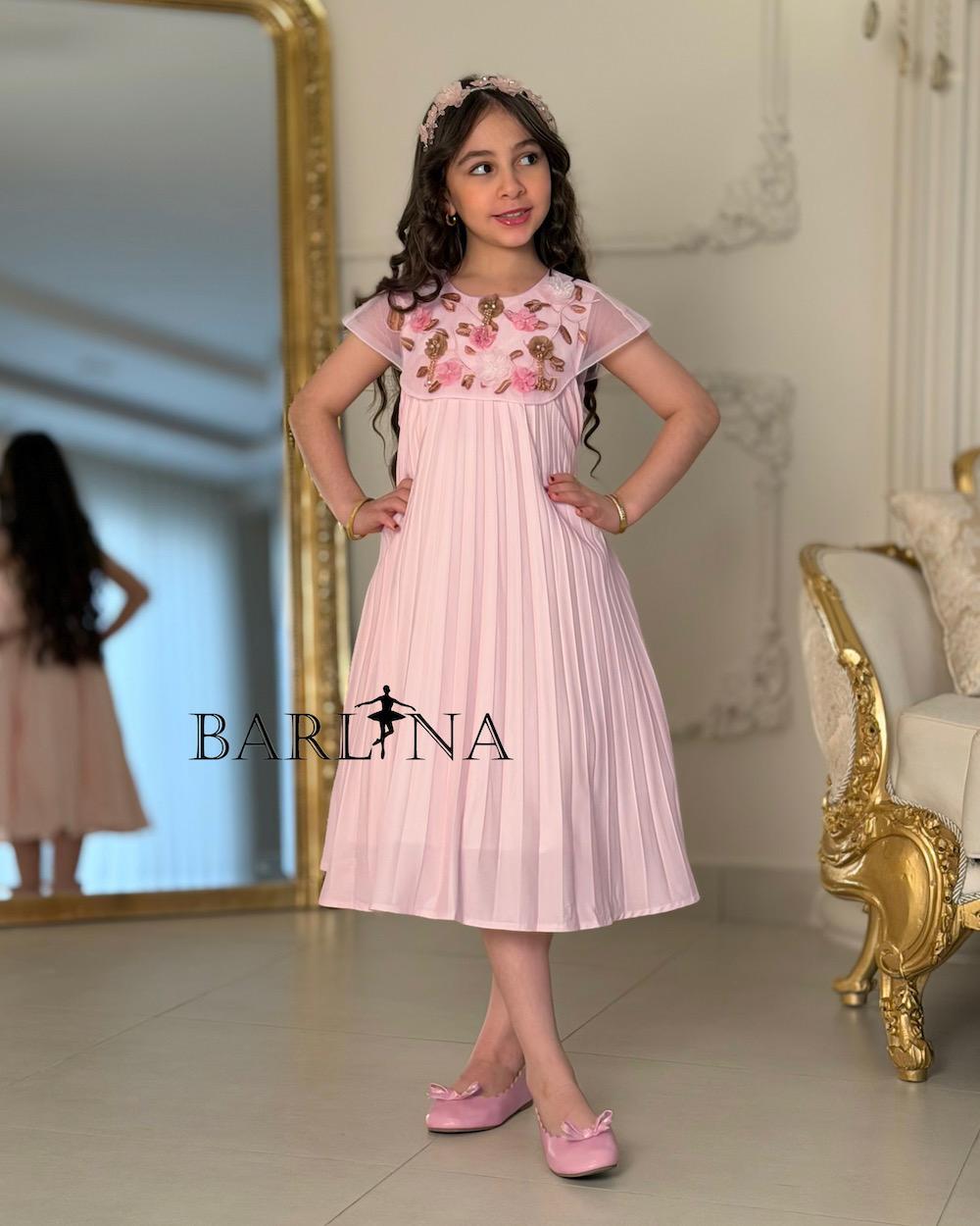A soft girl's dress with floral embroidery
