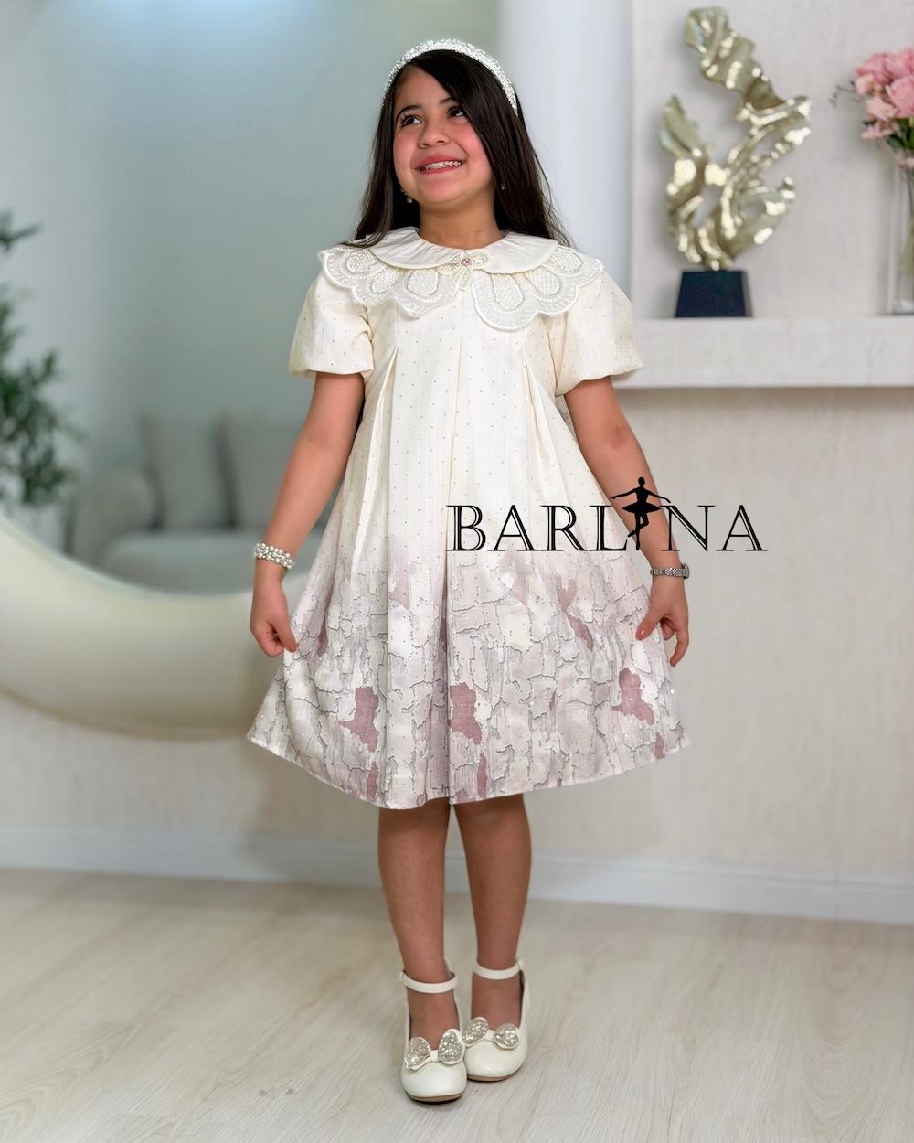 A short girl's dress decorated with delicate embroidery