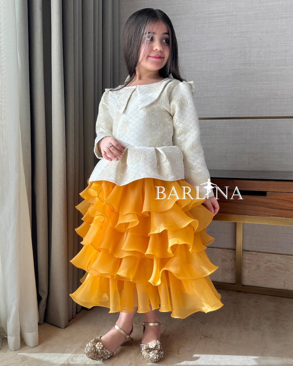 Girls' distinctive orange peplum dress