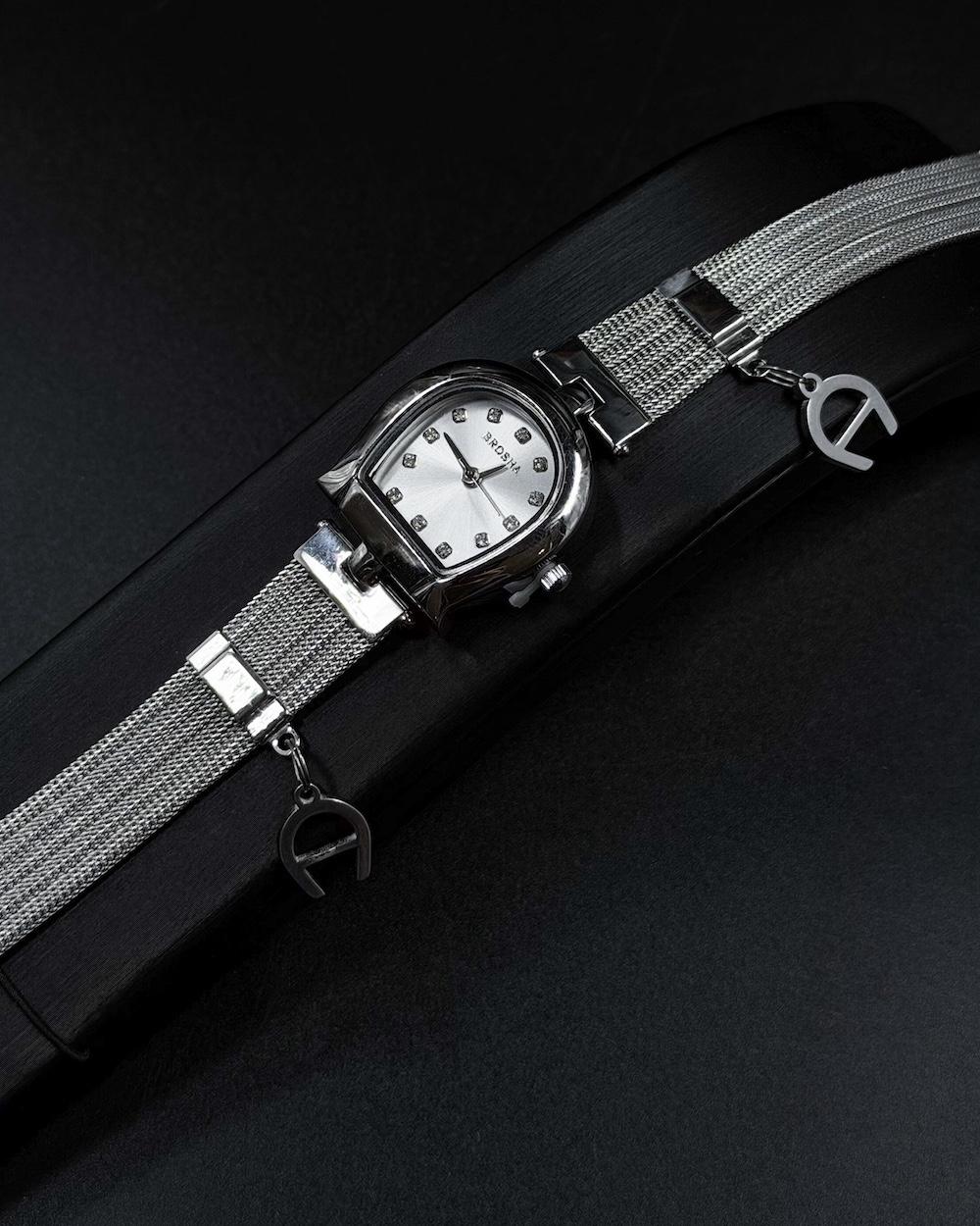 Elegant women's watch adorned with a charm