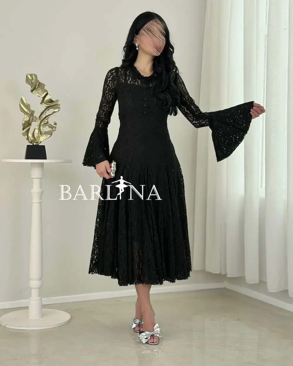 A soft dress adorned with elegant lace patterns