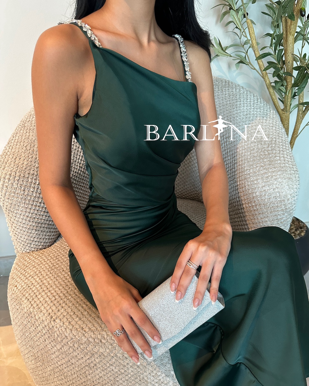 Emerald green dress with pleats at the waist