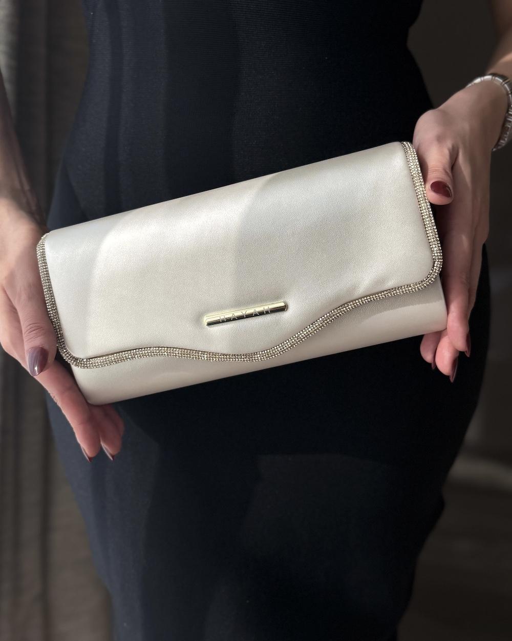 Clutch bag decorated with crystal trim