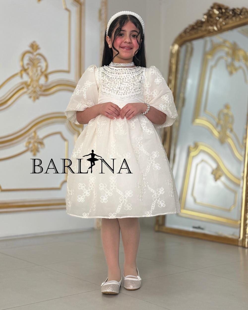 A soft, pearl-decorated girl's dress