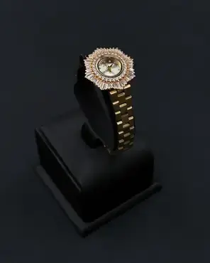 Elegant women's watch with a round studded bezel
