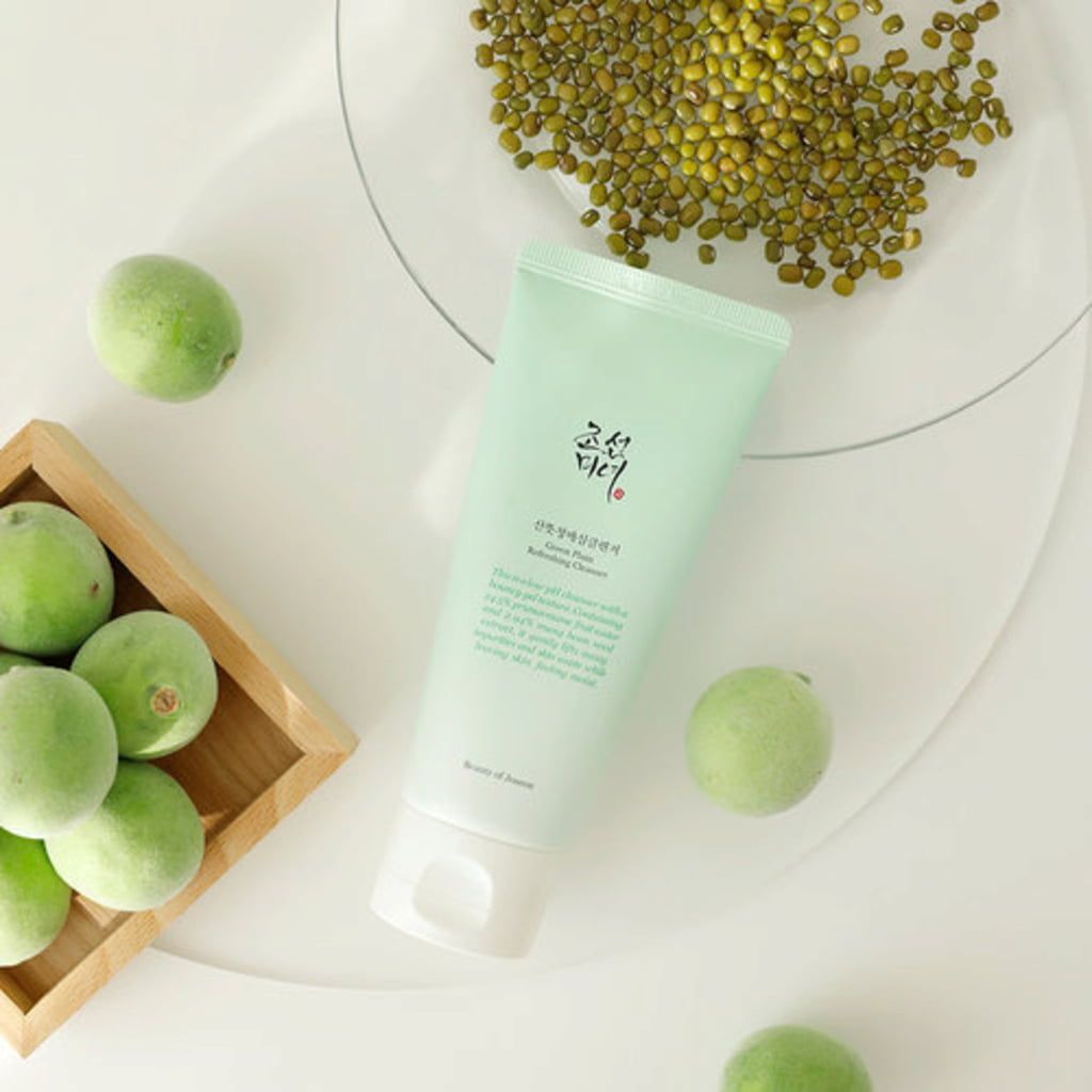 A green cream tube and a vegetable oil bottle in the background