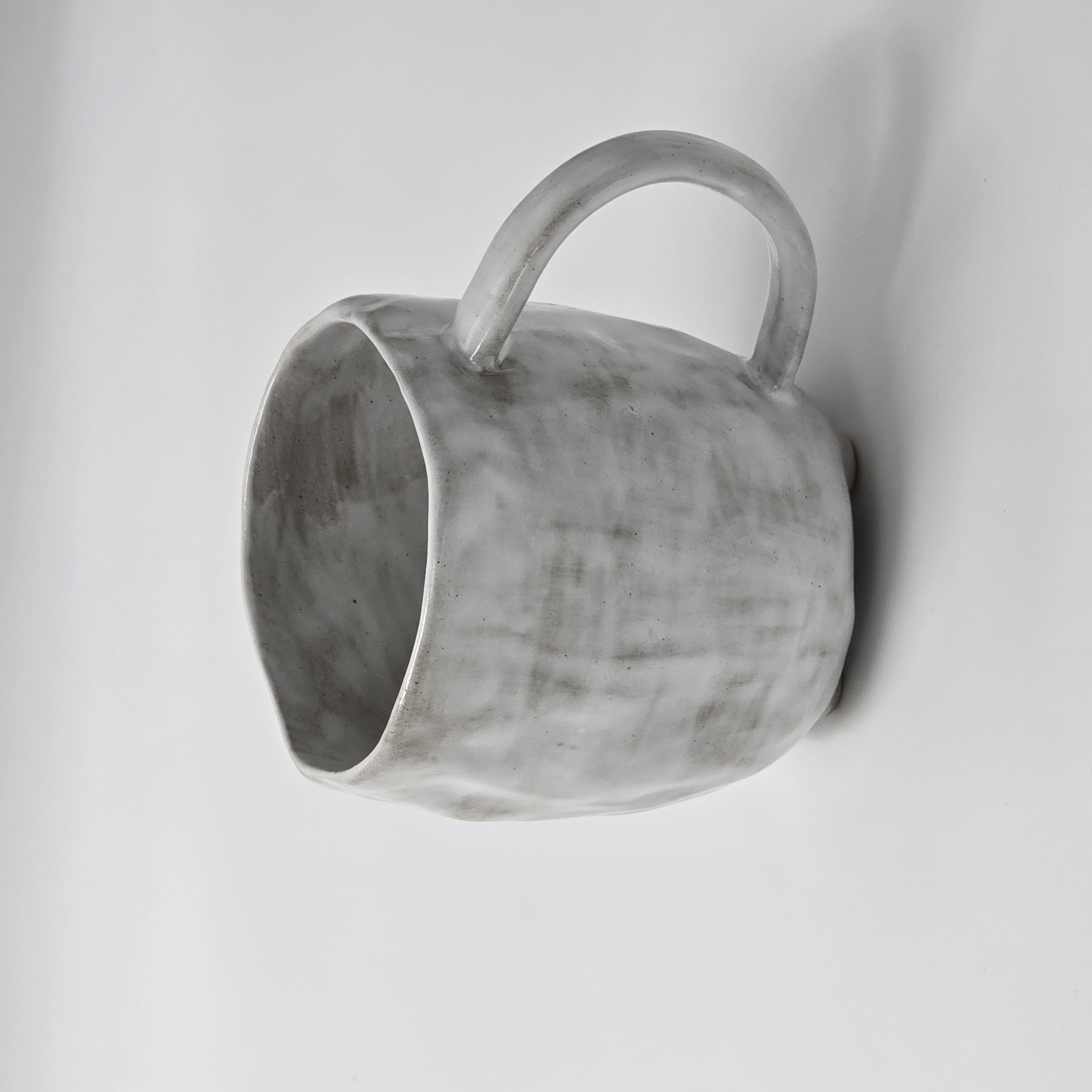 Coffee cup with heat-safe surface