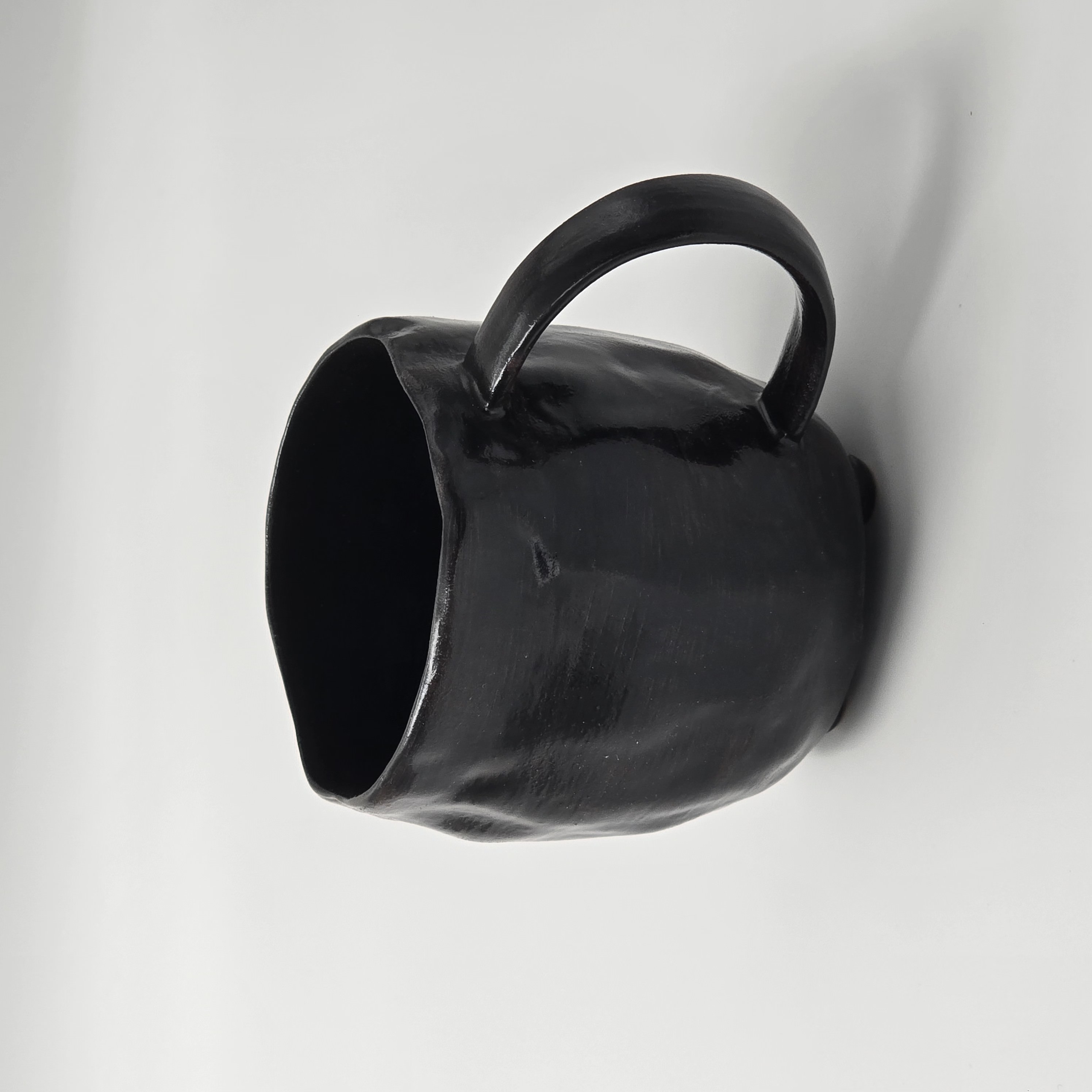 Coffee cup with heat-protective outer finish