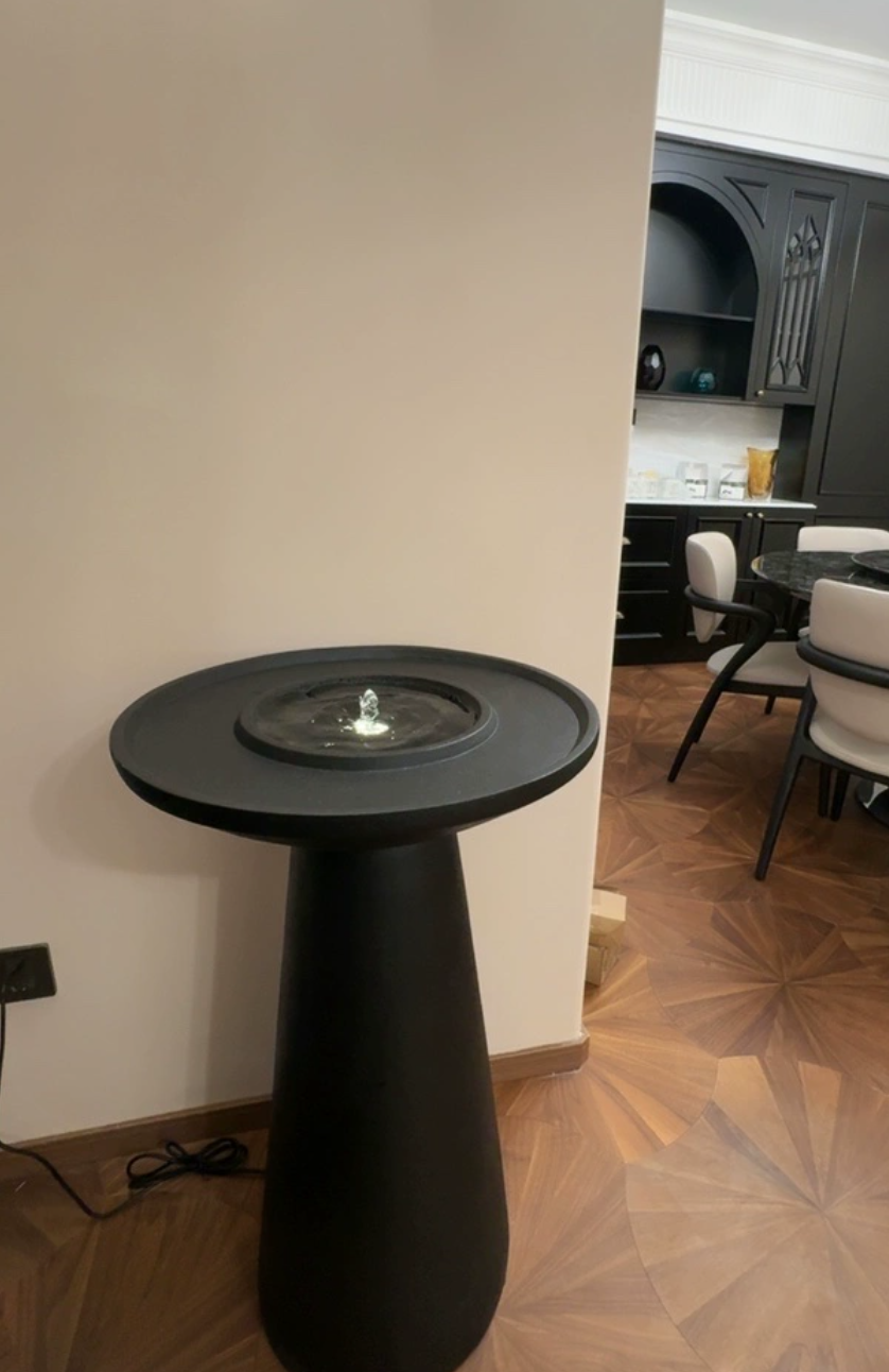  A fountain with a modern design and a serene atmosphere 