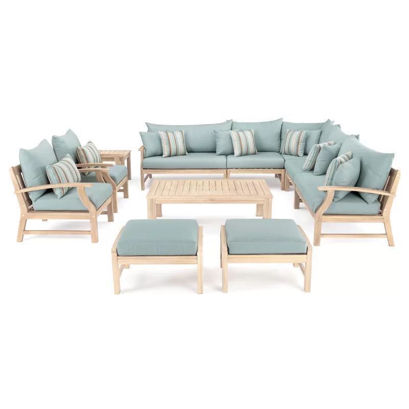 Outdoor seating set including a corner sofa armchairs ottomans and a coffee table