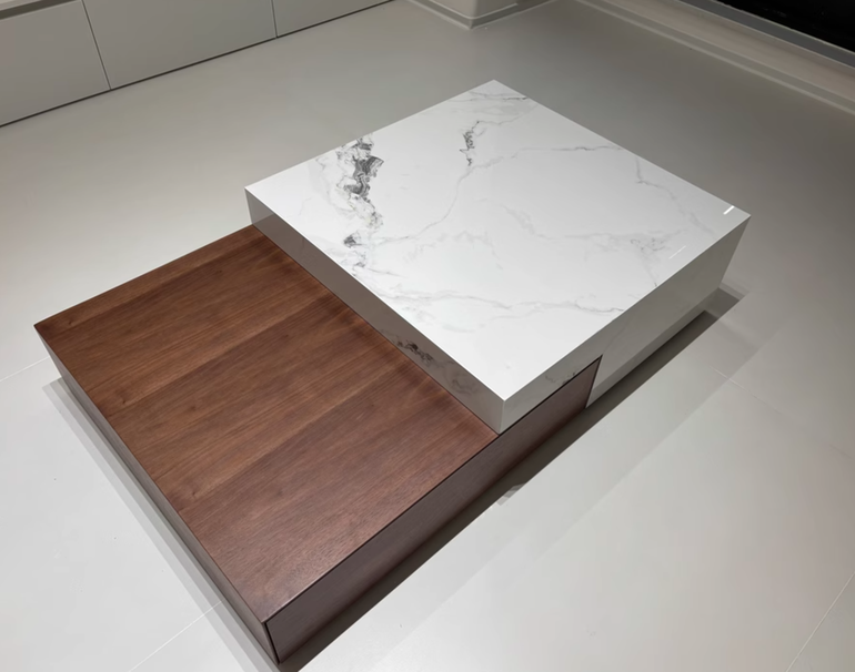 Image of a modern coffee table combining white marble and dark wood with a practical and beautiful twolevel design