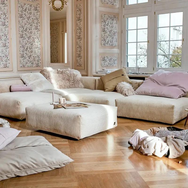 A comfortable corner sofa with cushions in a stylish living room