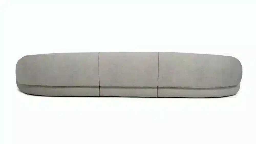 صورة لكنبة ركنية عصرية رمادية اللون على شكل حرف L