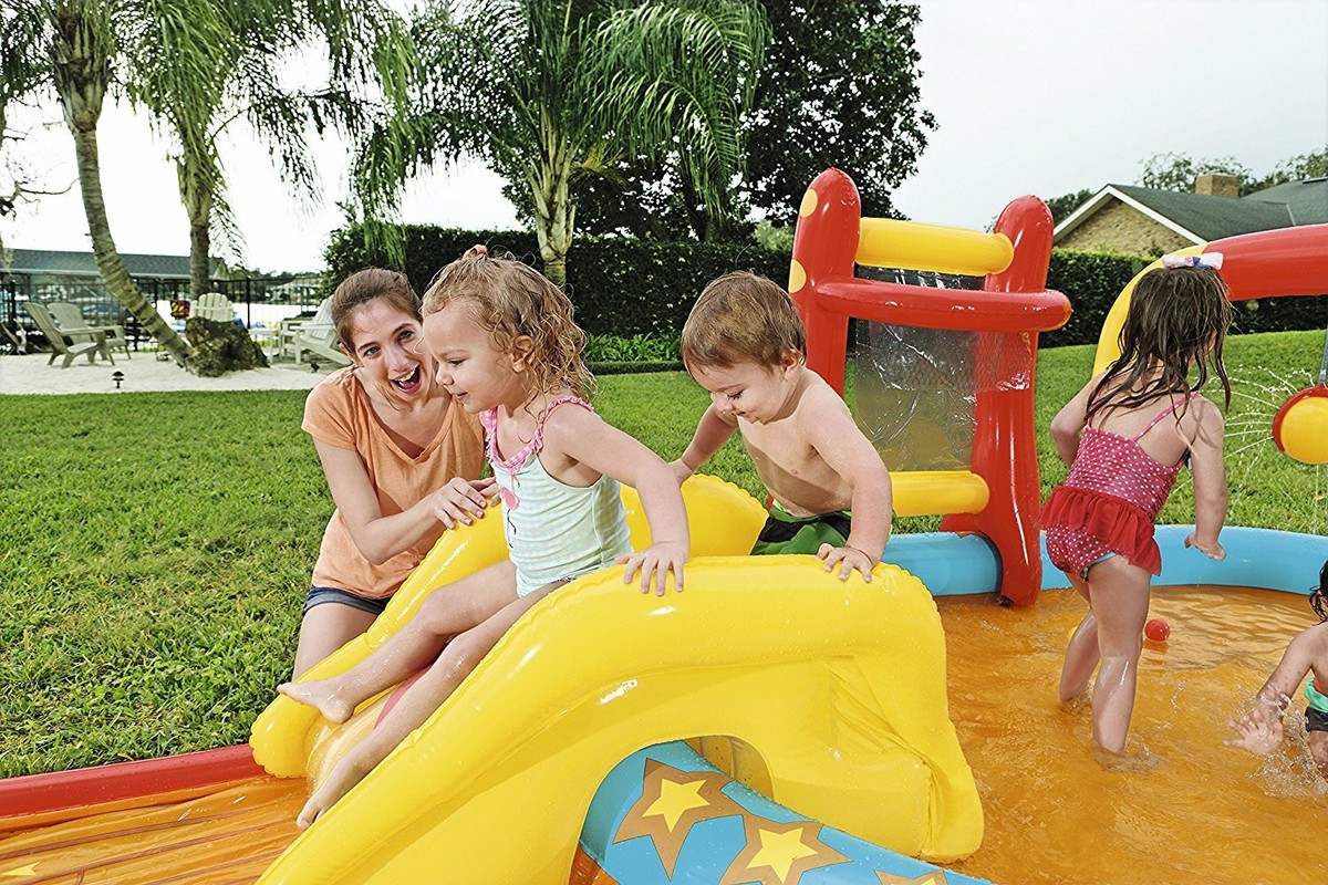  Kids’ pool with an attractive water park design – pool with slide and fun interactive toys 