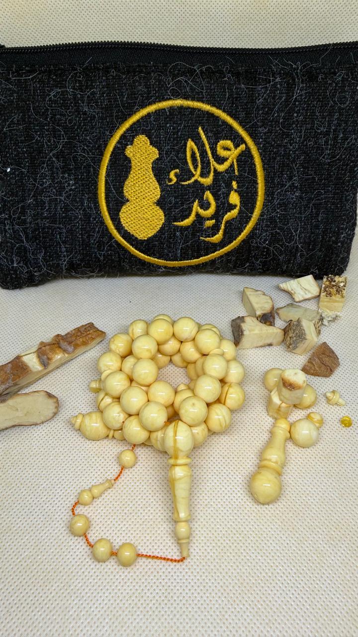 مسباح كهرمان طبيعي حجر واحد بشكل مدور وخراطة علاء فريد
