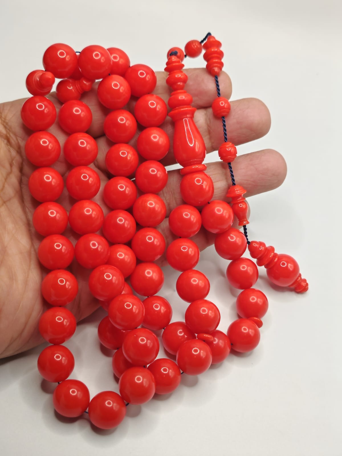 Vintage cast Bakelite Afyash misbaha with 43 red pigeon egg shaped beads.