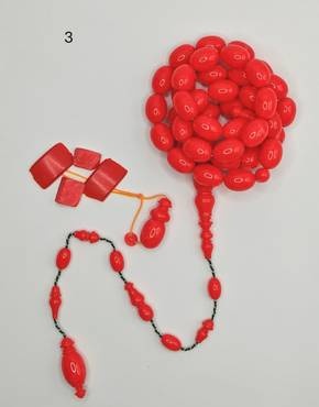 Vintage cast Bakelite Afyash misbaha with 43 red pigeon egg shaped beads.