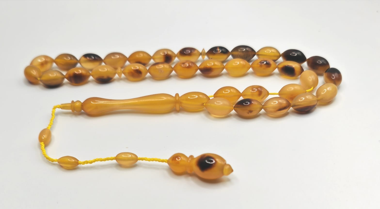 Natural Turtle Claw yellow misbaha with 33 olive shaped beads 10x6mm.