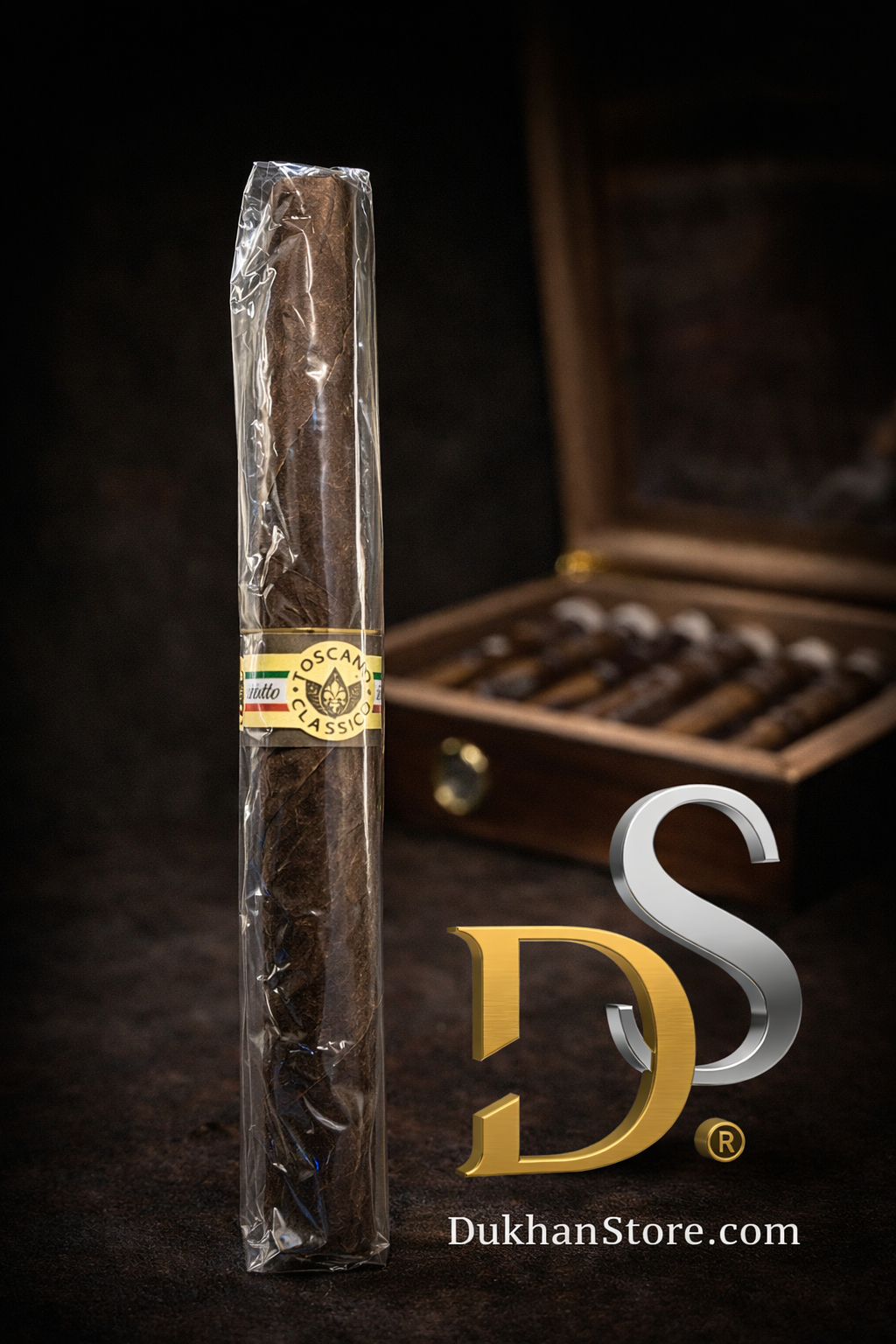 Toscano Classico Italian cigar wrapped in cellophane standing in front of a luxury cedar humidor filled with Toscano cigars