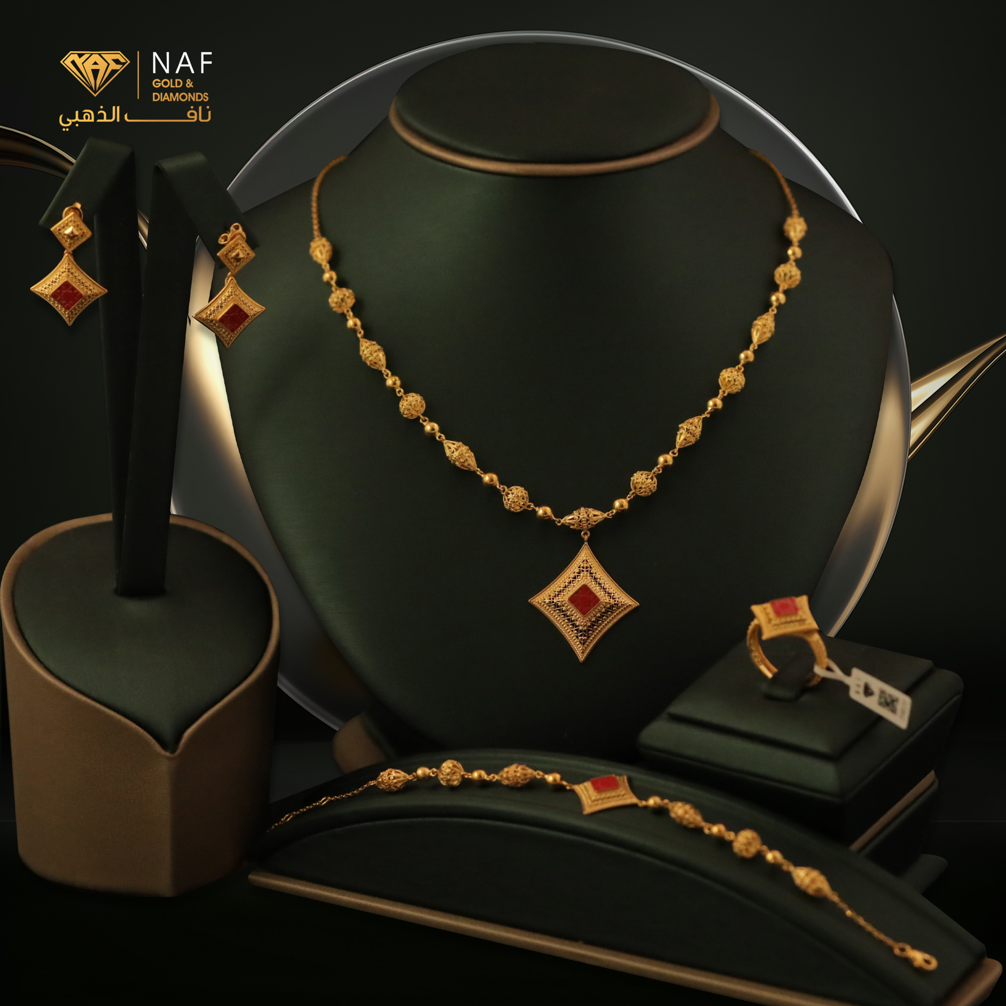 Gold necklace and bracelet with red stones