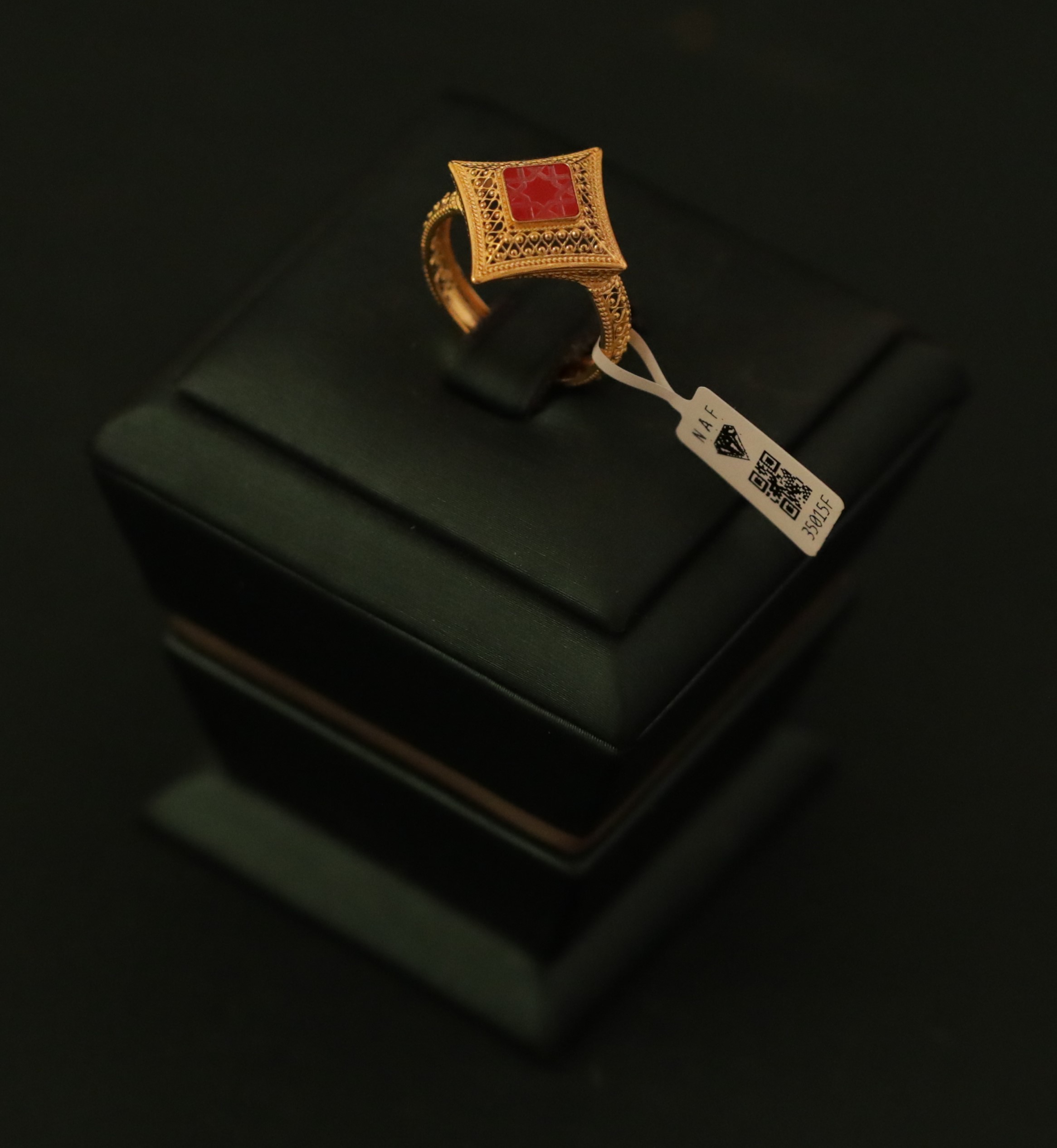 Gold bracelet with red stones