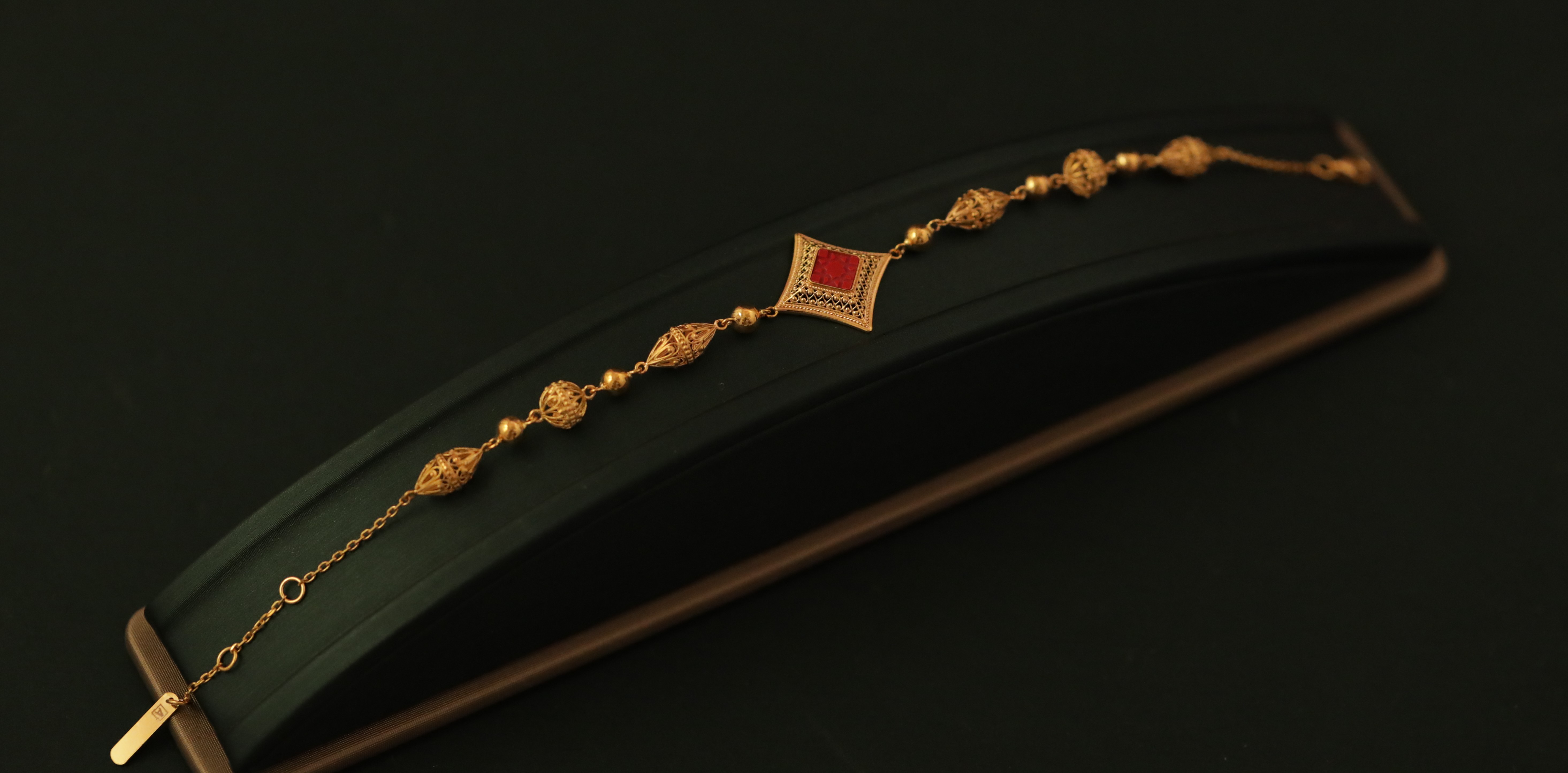 Gold earrings with red stones