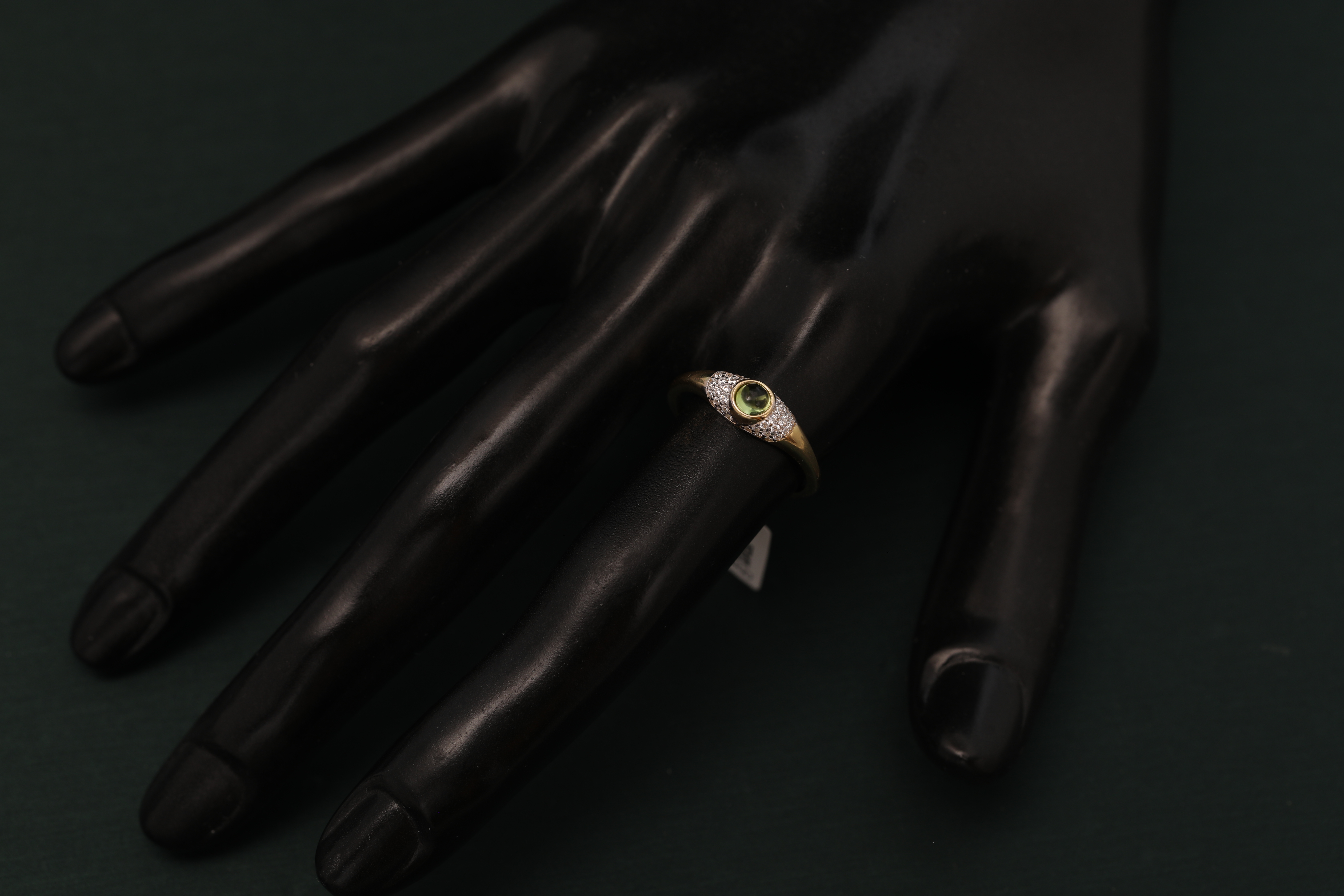 Black gloves with blurred golden details