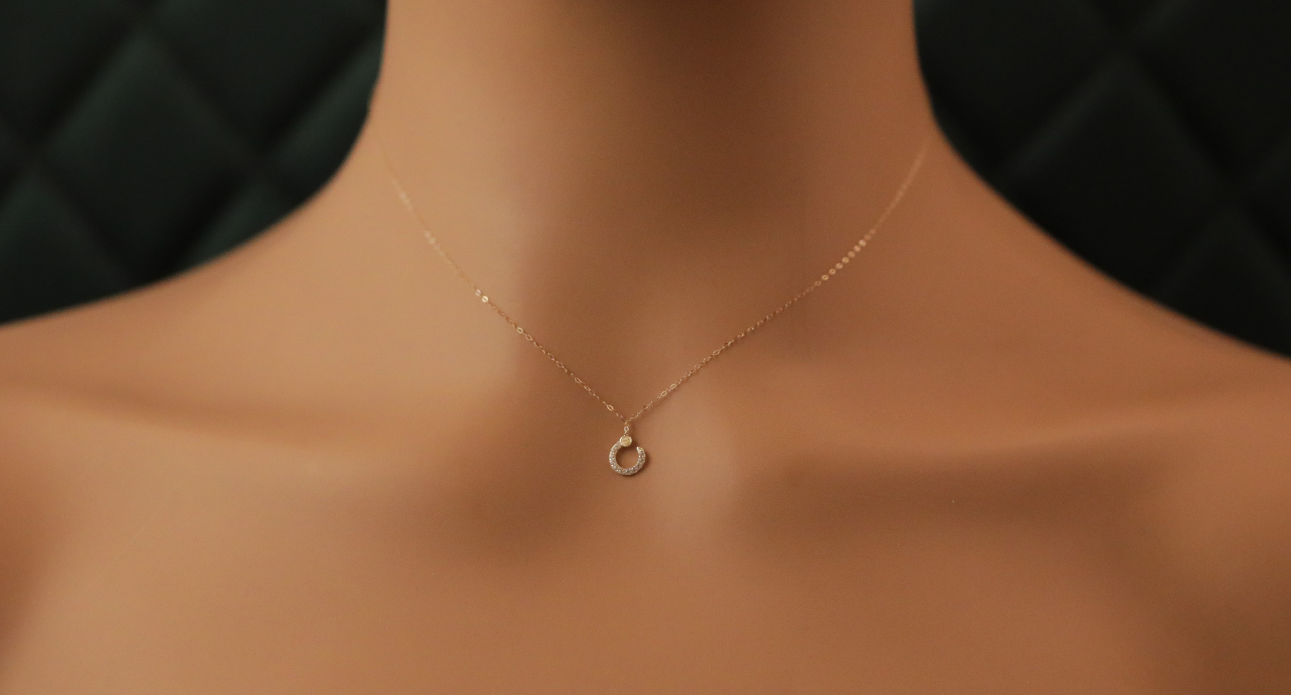 Gold necklace with a elegant crescent charm