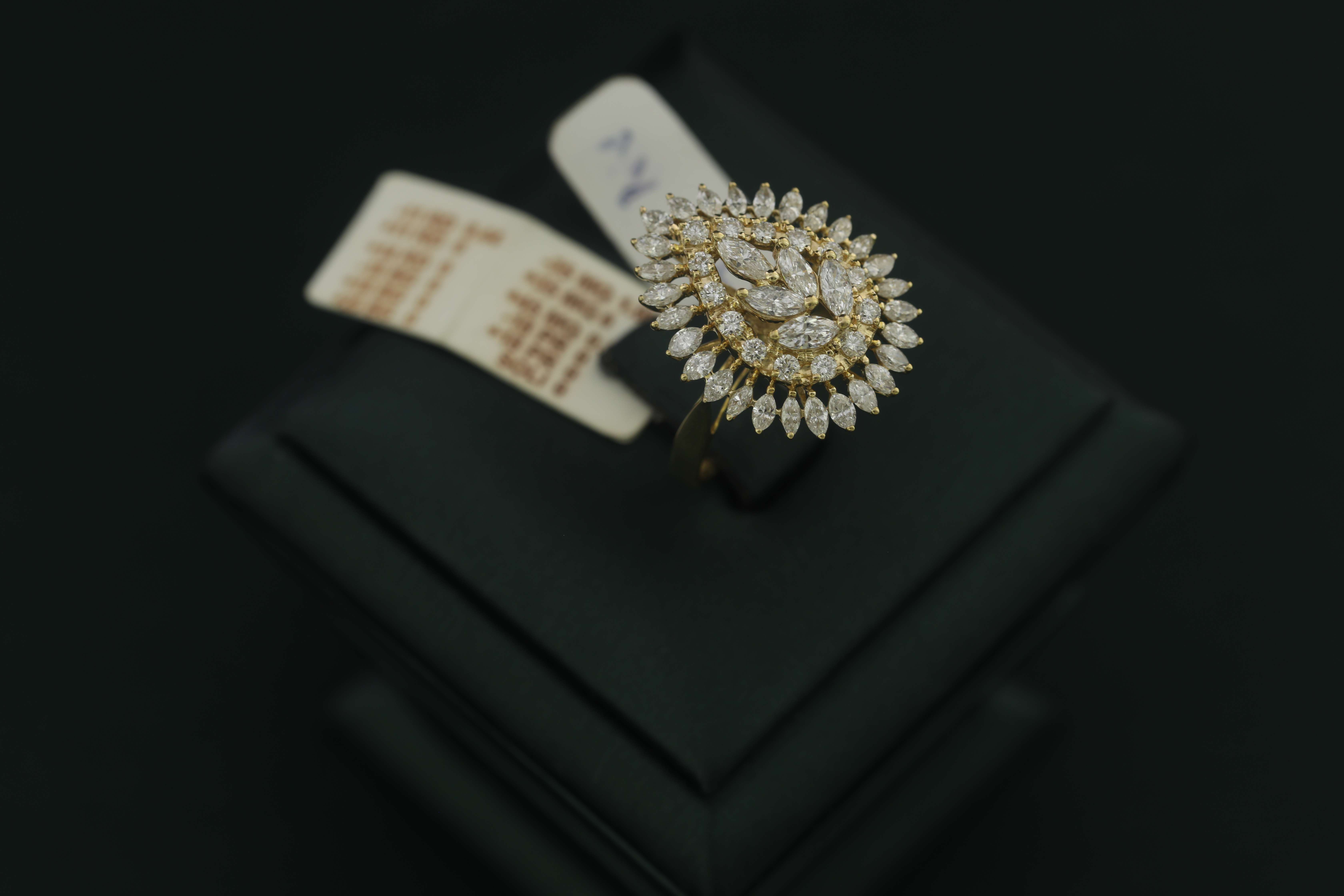 Elegantly bejeweled diamond ring on a black backdrop