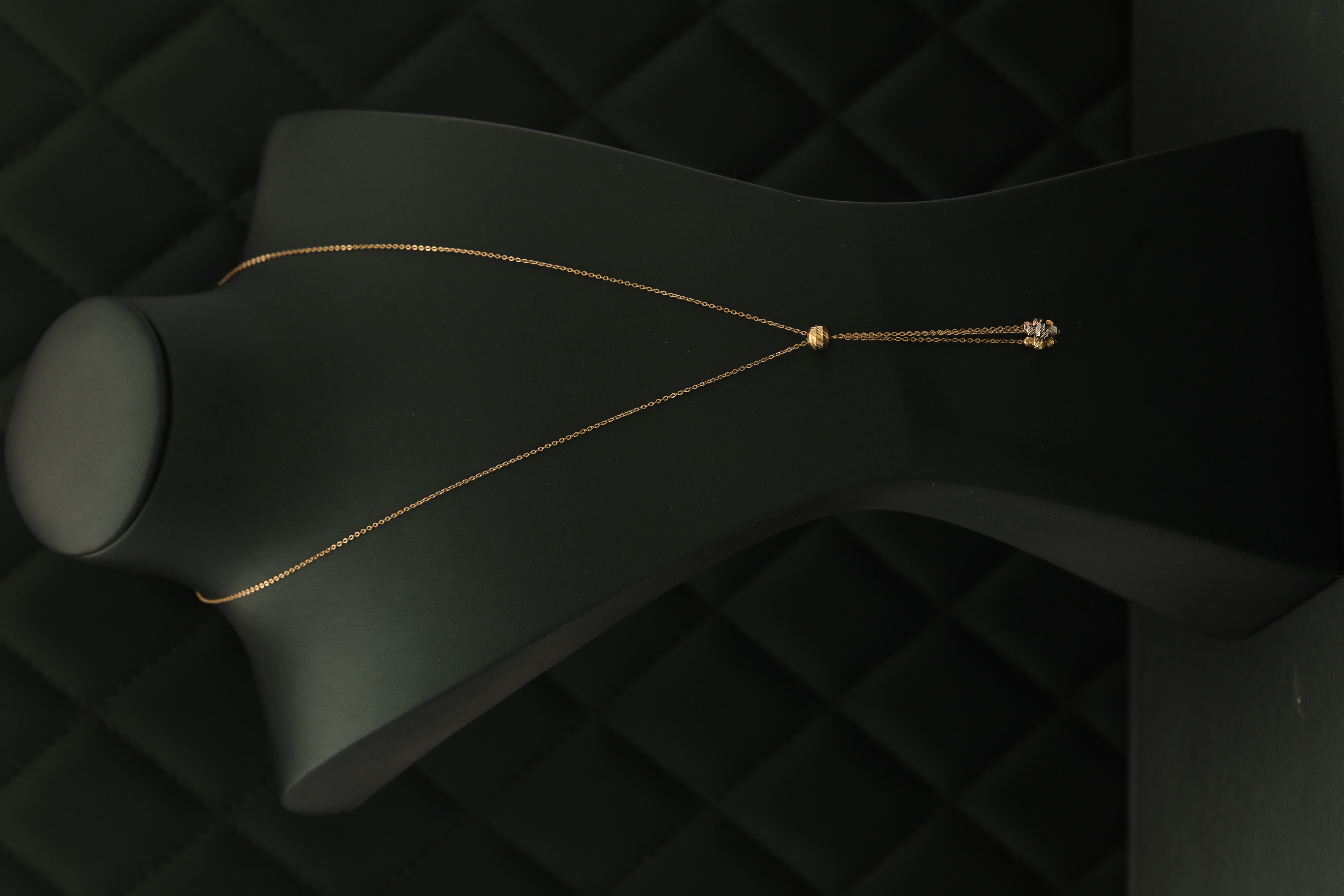 Thin gold necklace with hanging diamond pieces