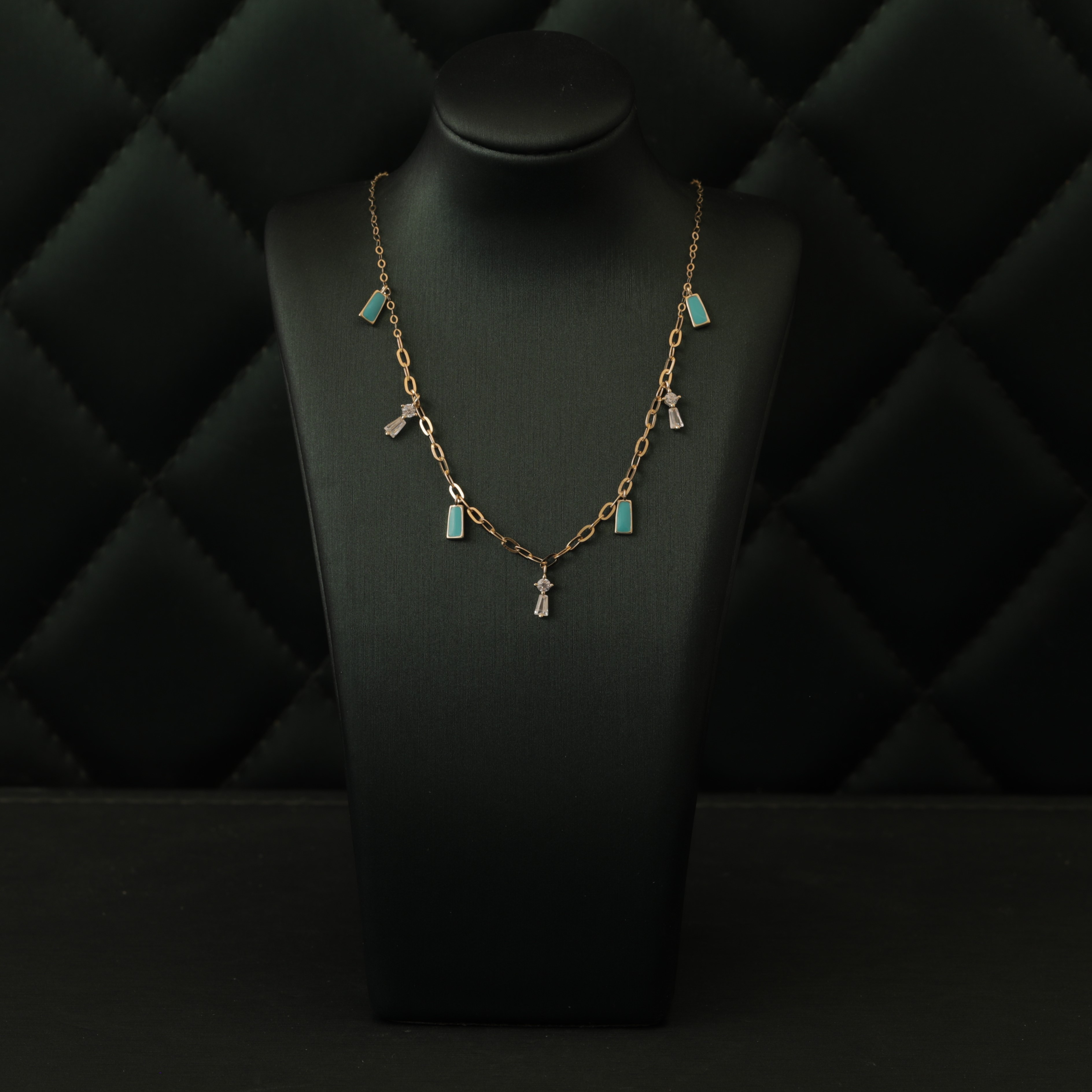 Gold necklace with blue stone decorations