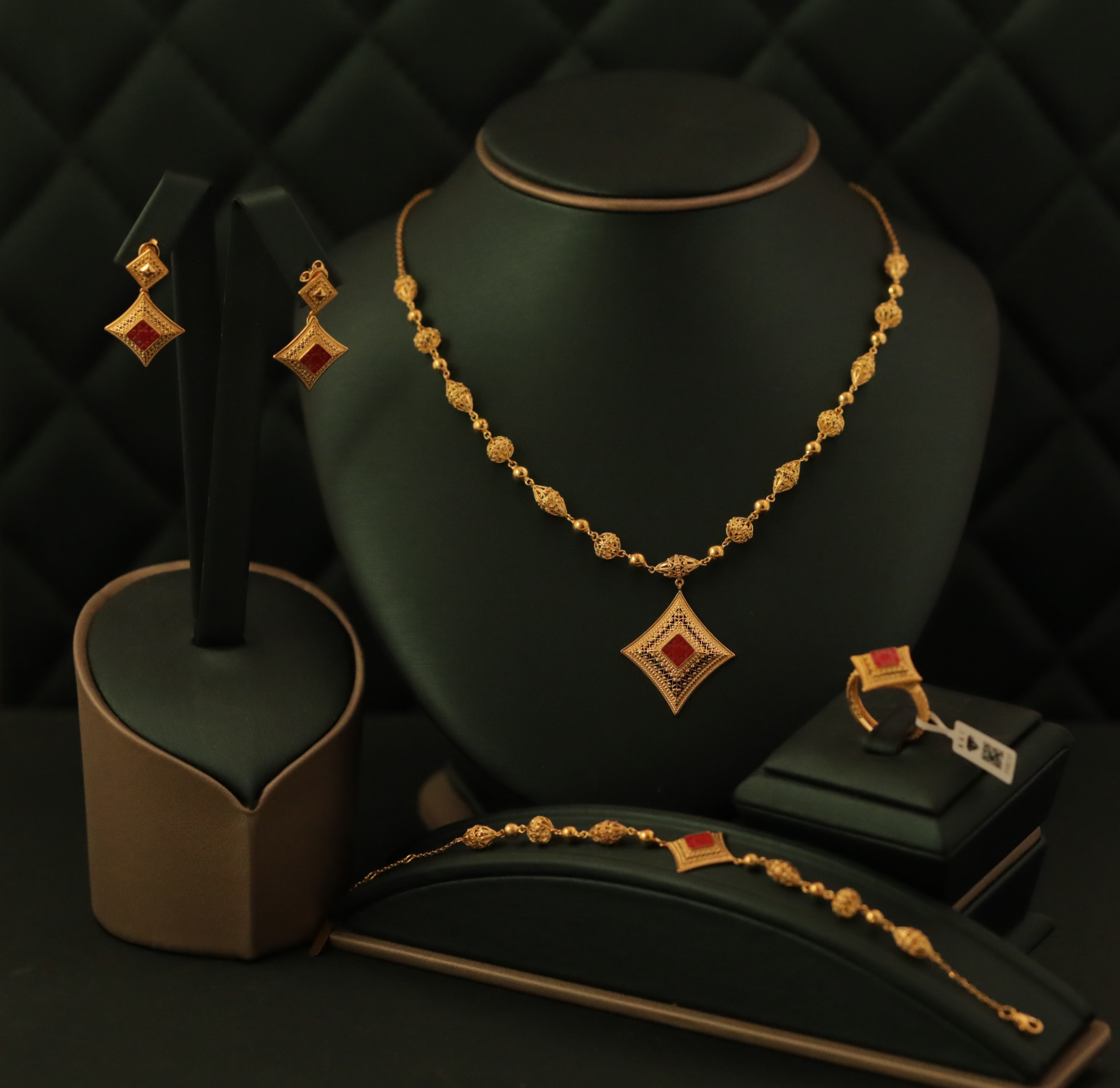 Gold necklace with red stones