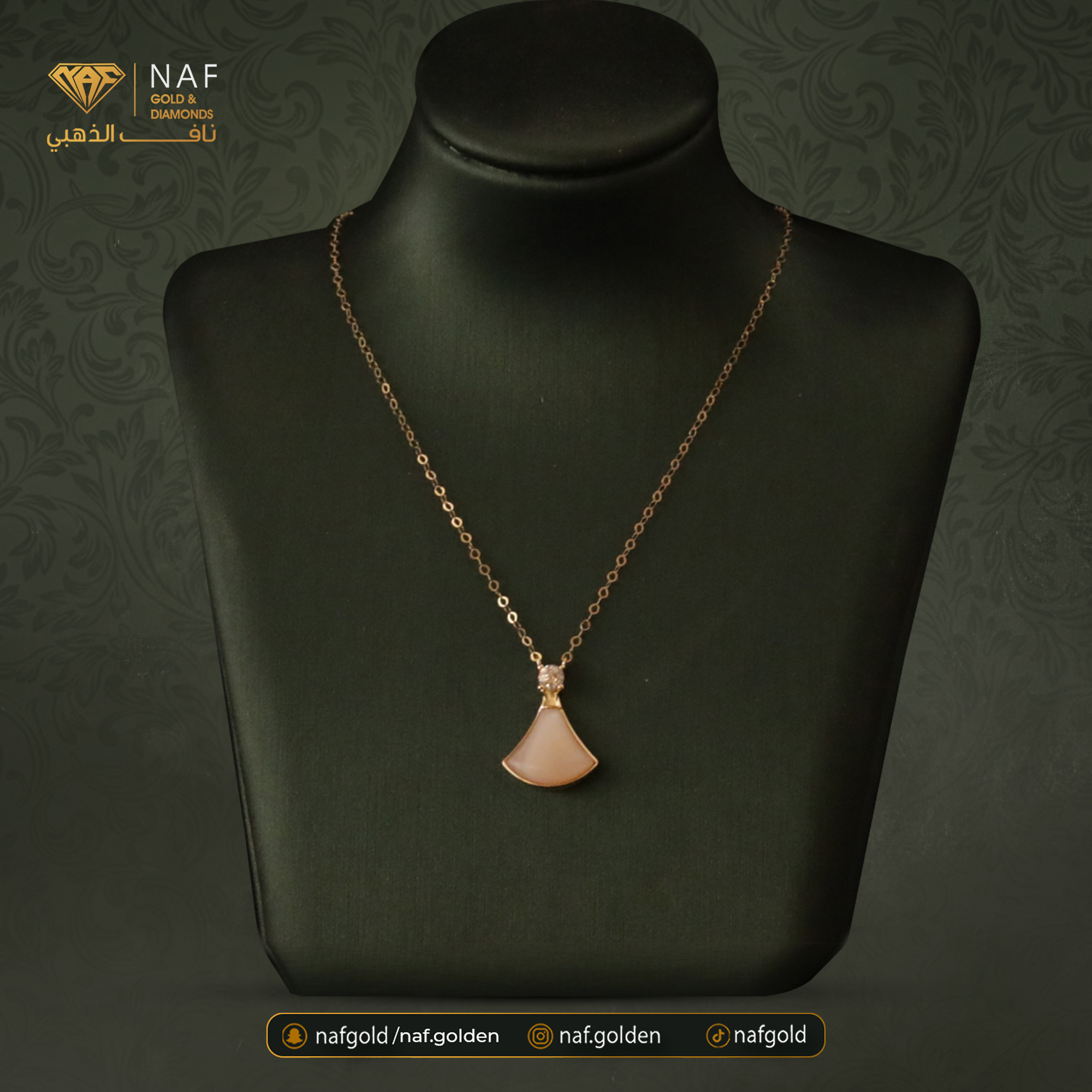 Gold necklace with pink gemstone charm