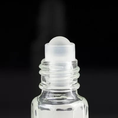 Empty quarter tola oil bottle with transparent plastic roller ball cap