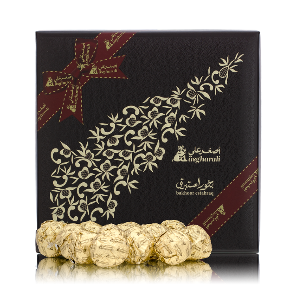 معجون معطر بخور 40 غرام أصغر علي علبة سوداء مزينة بنقوش ذهبية وكرات معطرة مغلفة باللون الذهبي