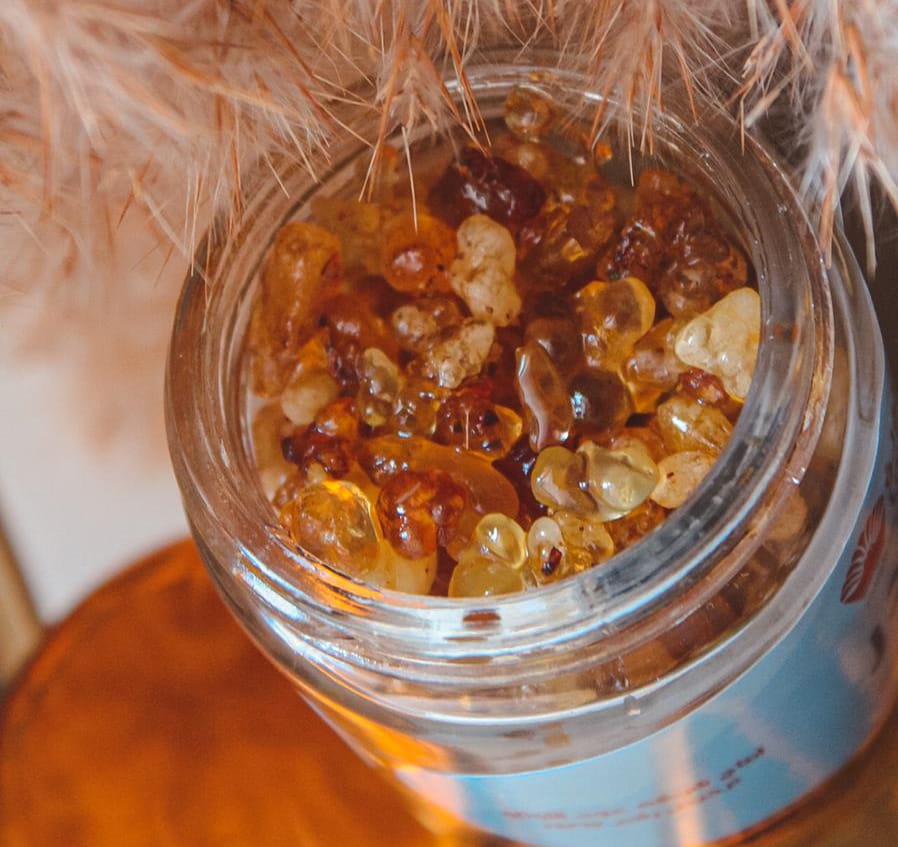 Luban Patchouli Bakhoor from AlMubarak Perfumes Bakhoor in a clear glass jar showing pieces of bakhoor up close
