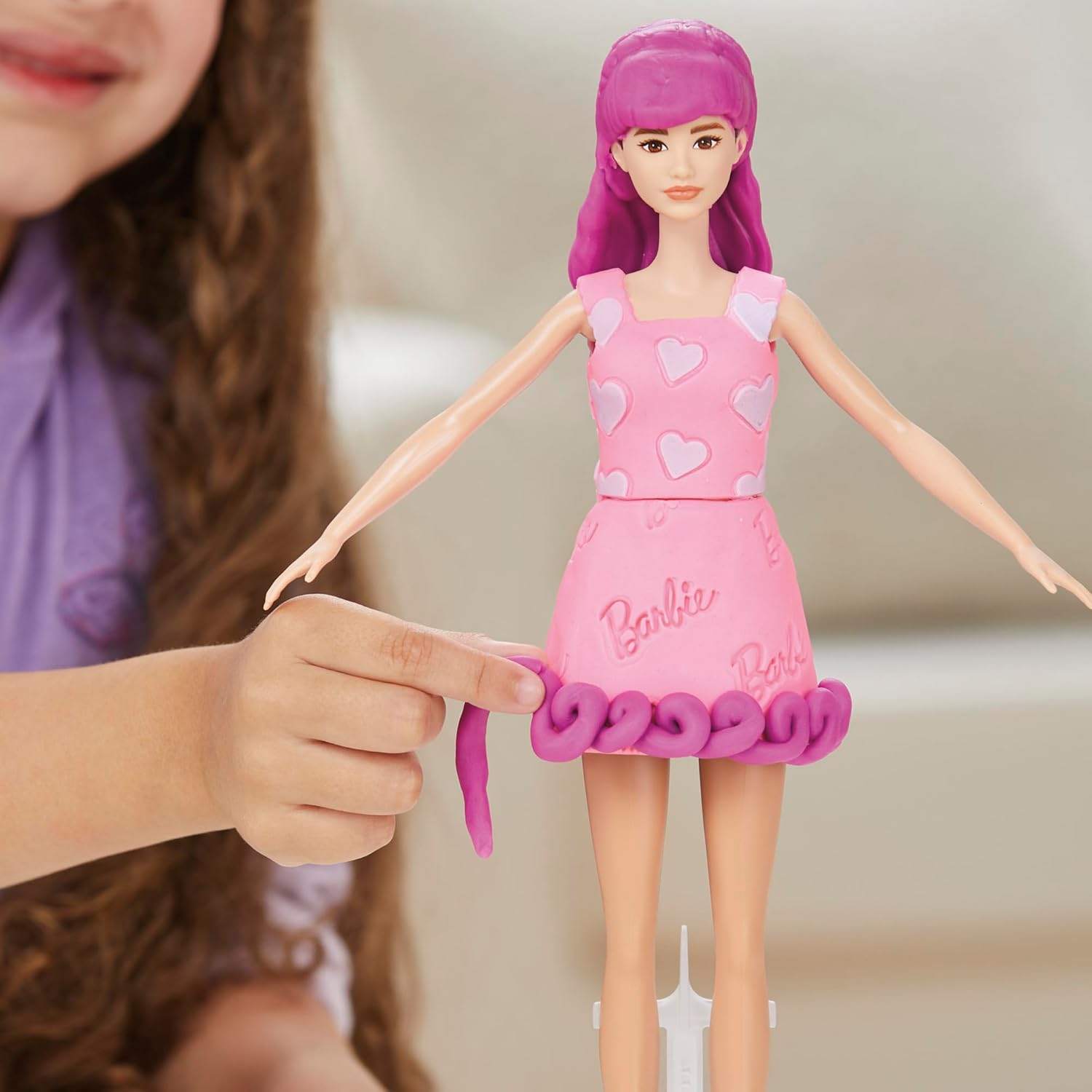 Changing Barbie's decorated outfit