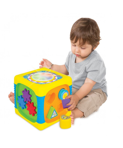 Child playing with music activity toy